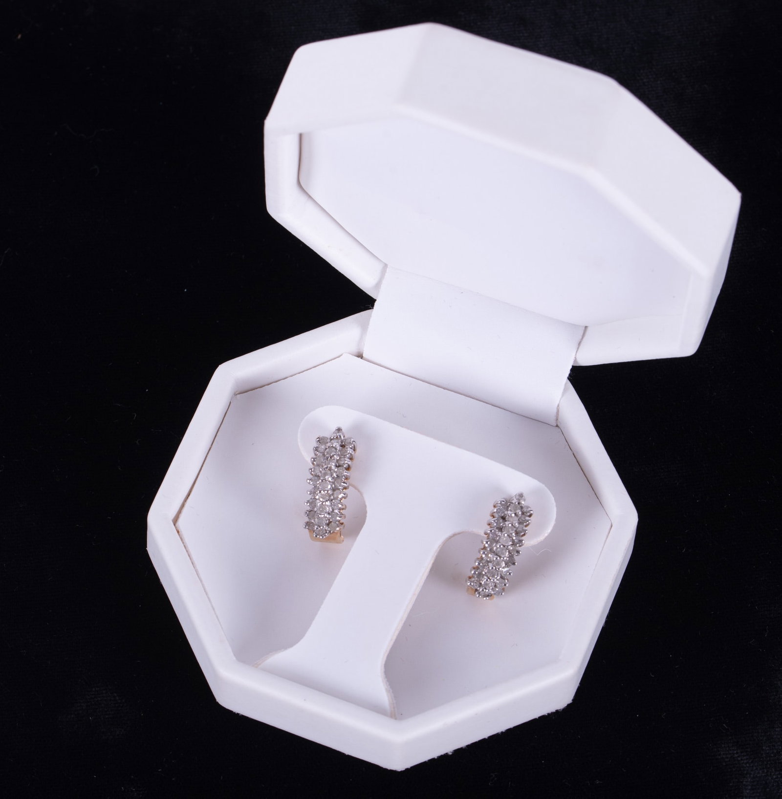 10K Half Hoop Earrings set with Diamonds: The earrings are yellow gold with approximately .75ctw in diamonds that are set in white gold. Weight including stones is 3.7g. The hoop measures 3/4 inch.