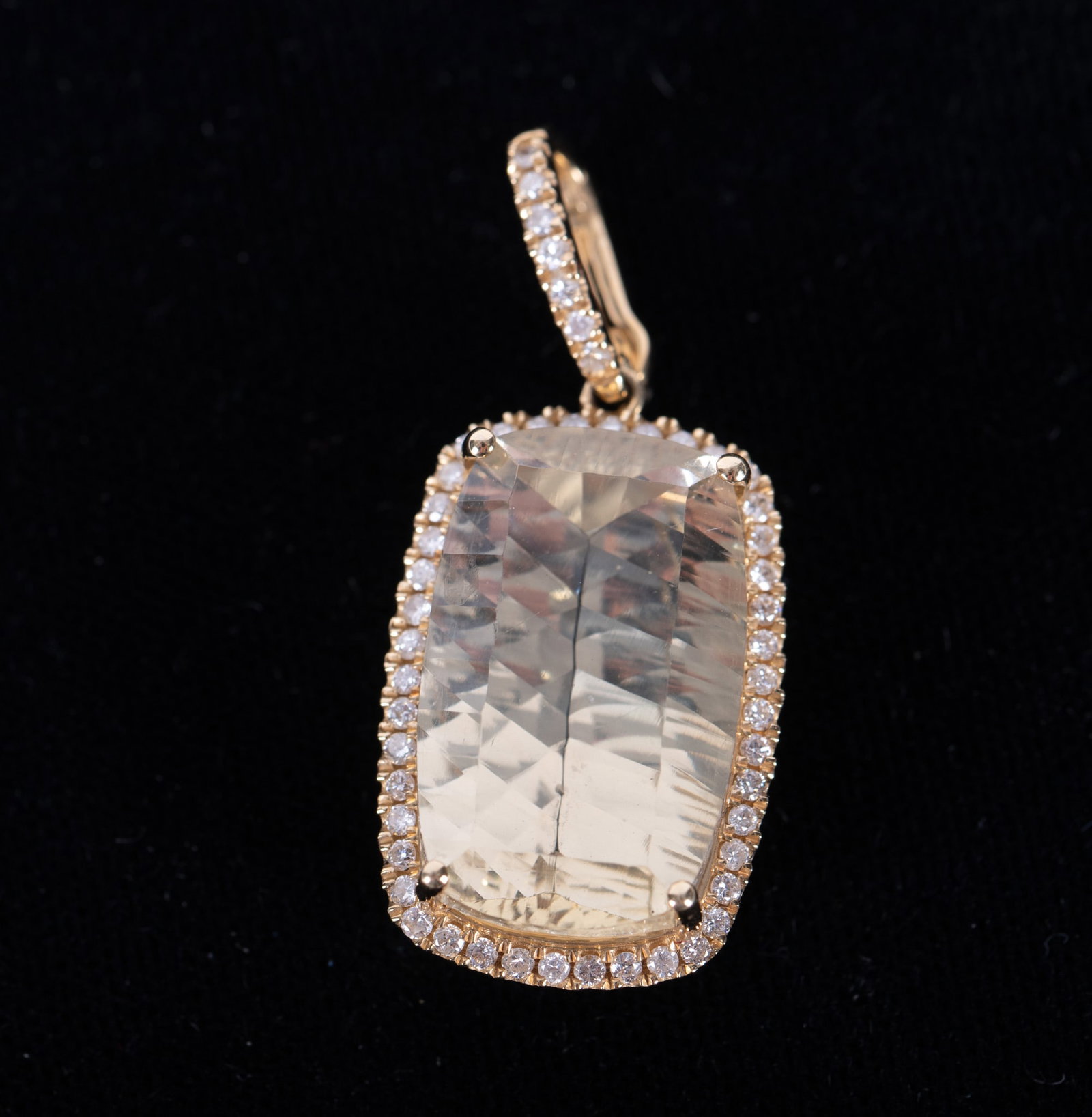 14K Yellow Gold Pendant set with Diamonds & Lemon Citrine: The fancy cut lemon citrine in this beautiful pendant measures 19.89mm x 12.40mm. Approximate diamond weight is .60ctw. The weight including stones is 5.4g. The clasp is a pearl clasp which allows