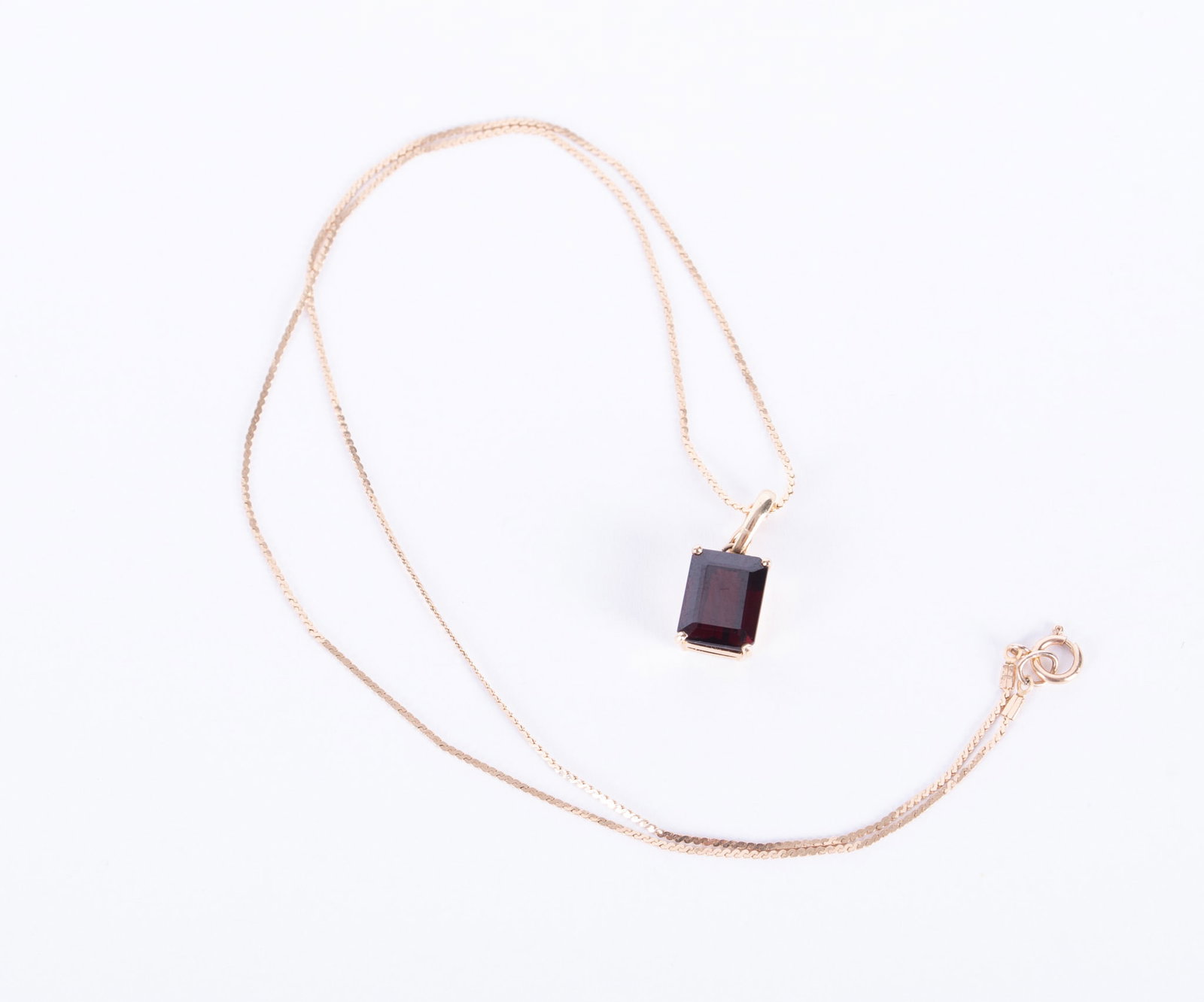 14K Yellow Gold Garnet Pendant on Chain: The pendant measures 10mm x 8mm and hangs from a 17 inch 14k chain. Weight including stone is3.26g.