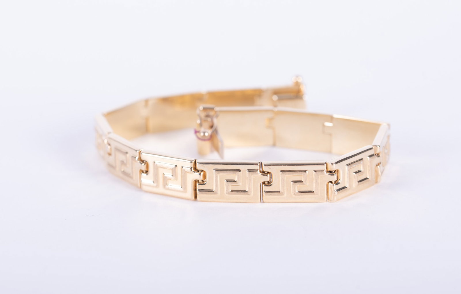 14K Yellow Gold Greek Key Design Bracelet: The bracelet is marked 14k Italy and weighs 11.1g. The length is 7 1/4 inches.