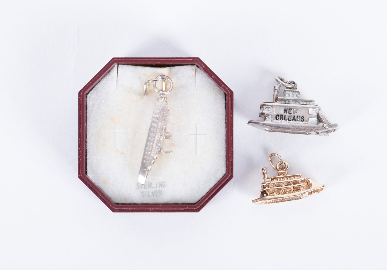 Three Ship Charms: First of the three is 14k yellow gold and weighs 3.17g. The two sterling ones weigh a total of 11.03g.