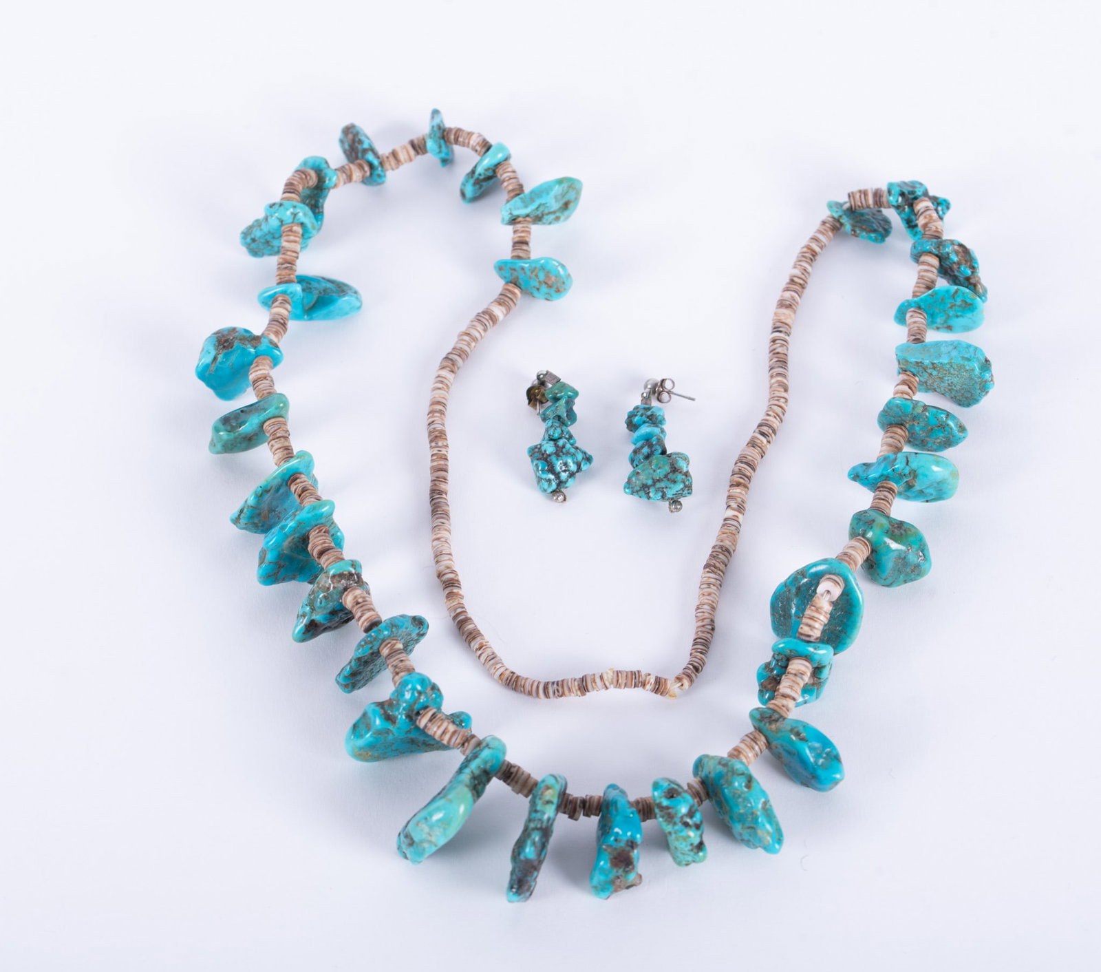 Native American Turquoise with Heishi Bead Necklace and Earrings: The turquoise nuggets in this necklace are excellent. It is 28 inches long; together with matching pair of earrings.