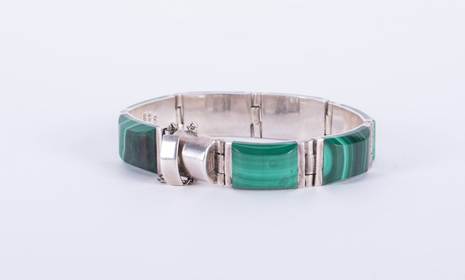 Malachite Bracelet set in 950 Silver-Mexico: The length on this striking bracelet is 7 1/2 inches. Weight including stones is 76.03g.
