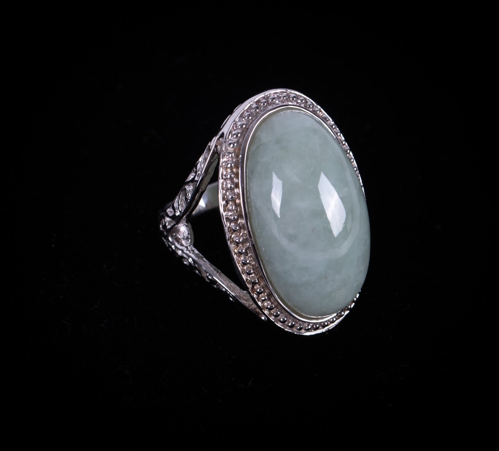 Sterling Ring set with Jade by "Lydia": The jade in this statement ring measures 26.30mm x 15.80mm. Ring size is 7 1/2.