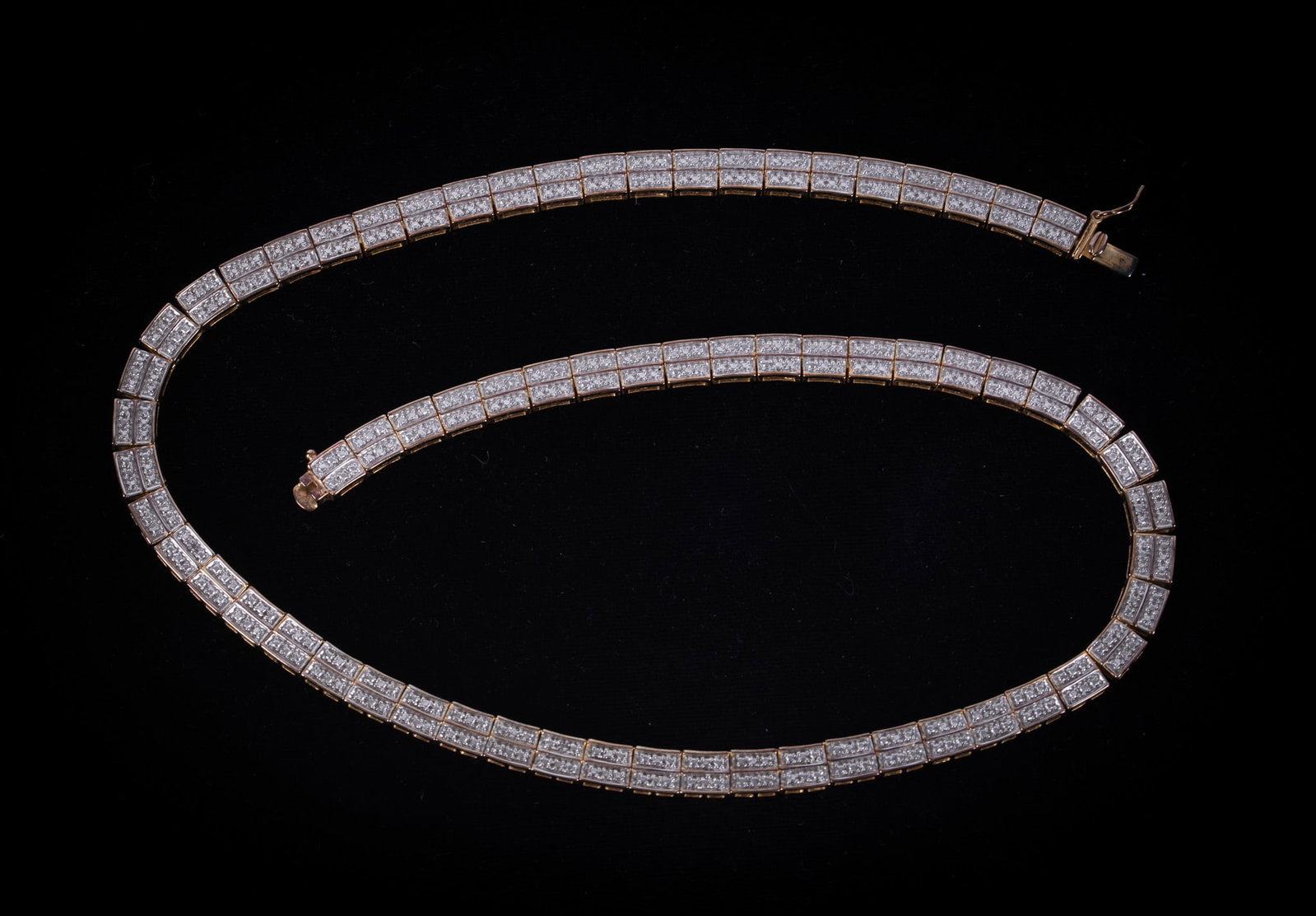 Sterling Vermeil Necklace: This interesting necklace has a combination of white and gold tones. The sterling top has a cutout design that gives the appearance of diamonds. It is 18 inches long and weighs 38.2g. It is marked
