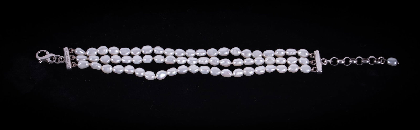 Tiffany Triple Strand Fresh Water Pearl Bracelet: The length of this bracelet is 6 1/2 inches with an extender chain measuring 1 1/2 inches. Clasp and extender are sterling silver.