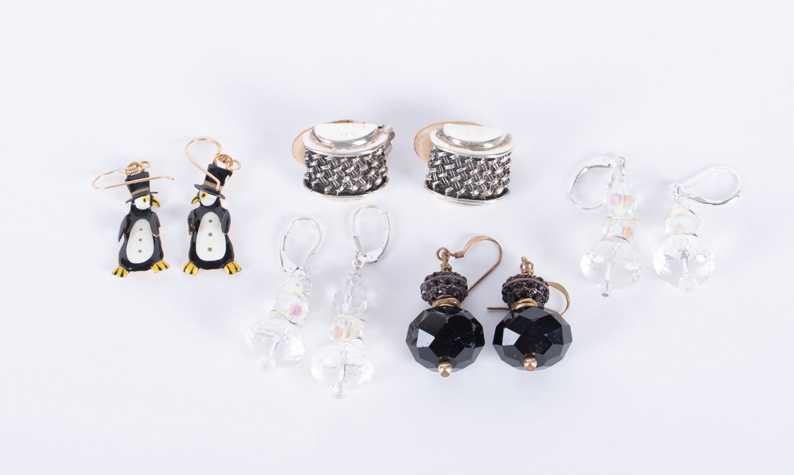 Five Interesting Pairs of Earrings: This is an intriguing lot with the Lunch at the Ritz penguin earrings. in addition, a pair of sterling clip earrings, two crystal pairs with sterling wires and a pair of faceted jet dangles set with g