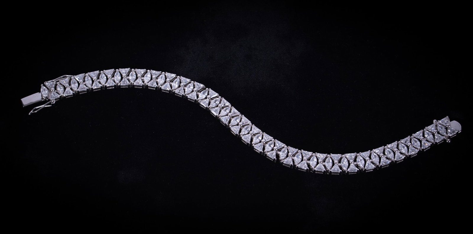 Sterling CZ Bracelet: This very nice quality CZ bracelet measures 8 inches long. Weight including stones is 29.3g.