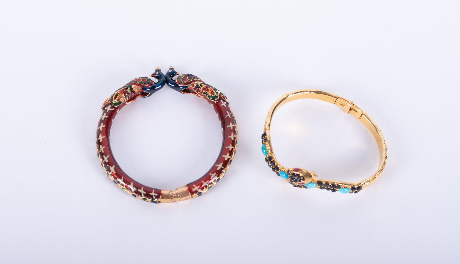 Hand Crafted Pade Vavra Hinged Bangle Bracelet together with Vintage Indian Cloisonn? Peacock Hinged: Pade Vavra bracelet inset with semi-precious stones, gold filled; together with cloisonn? enamel peacock bracelet.