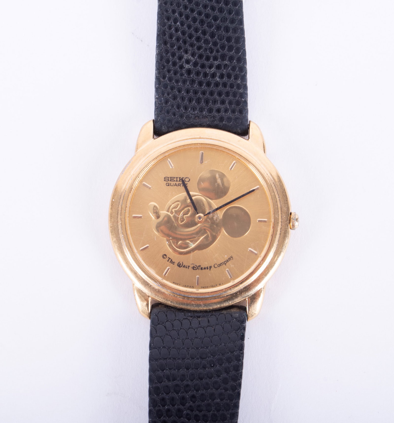 Men's Vintage 1993 Seiko Quartz Disney Wristwatch: Gold tone face with Mickey Mouse Head, Seiko Quartz, The Walt Disney Company; base metal, stainless steel back, #363695, with black snake leather wristband.