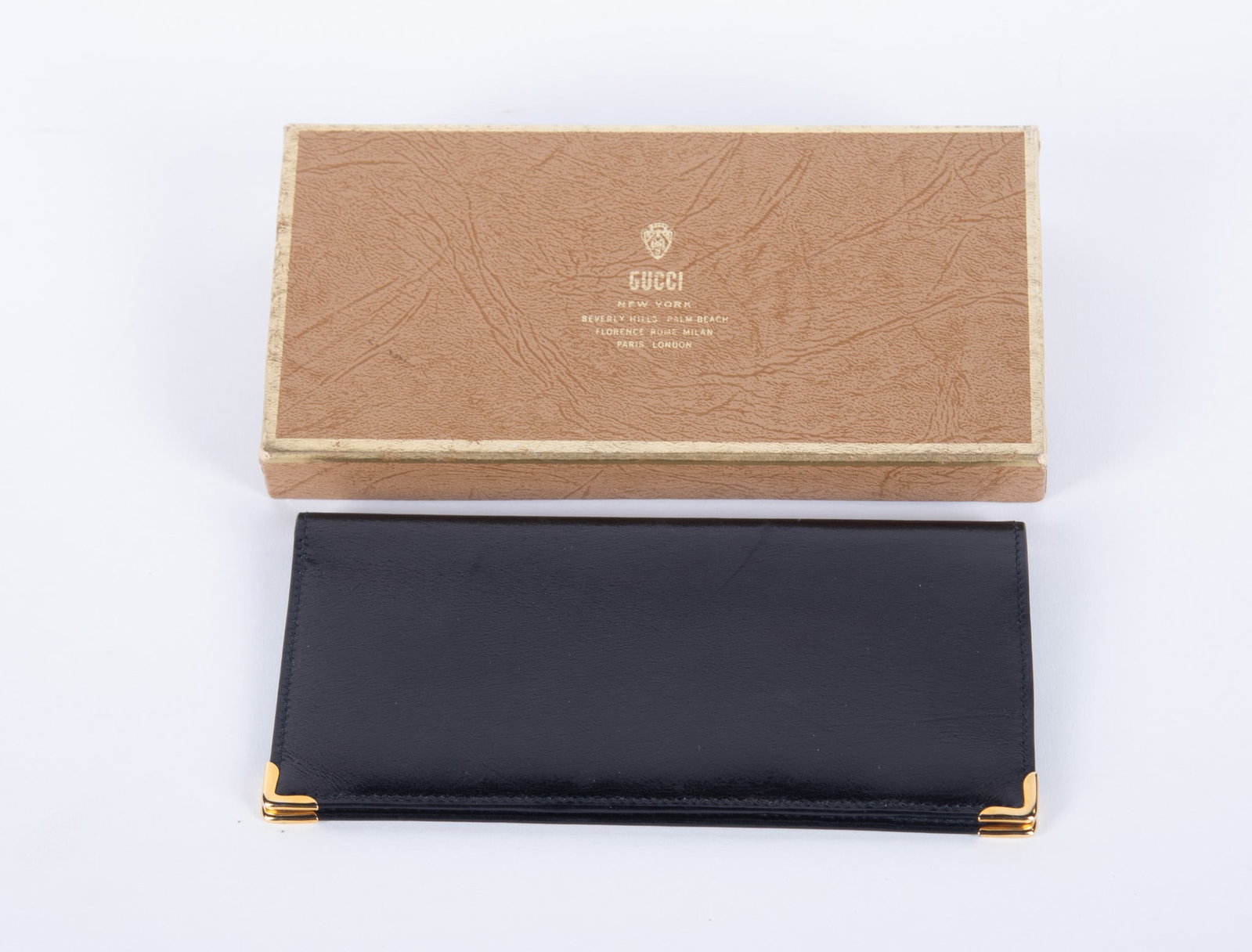 Vintage Gucci Card Wallet with Original Box: This black leather card holder/wallet with multiple slots was Made in Italy by Gucci. Date stamped on original Gucci box Aug. 1979. Size 6 3/4 x 3 1/2 inches.