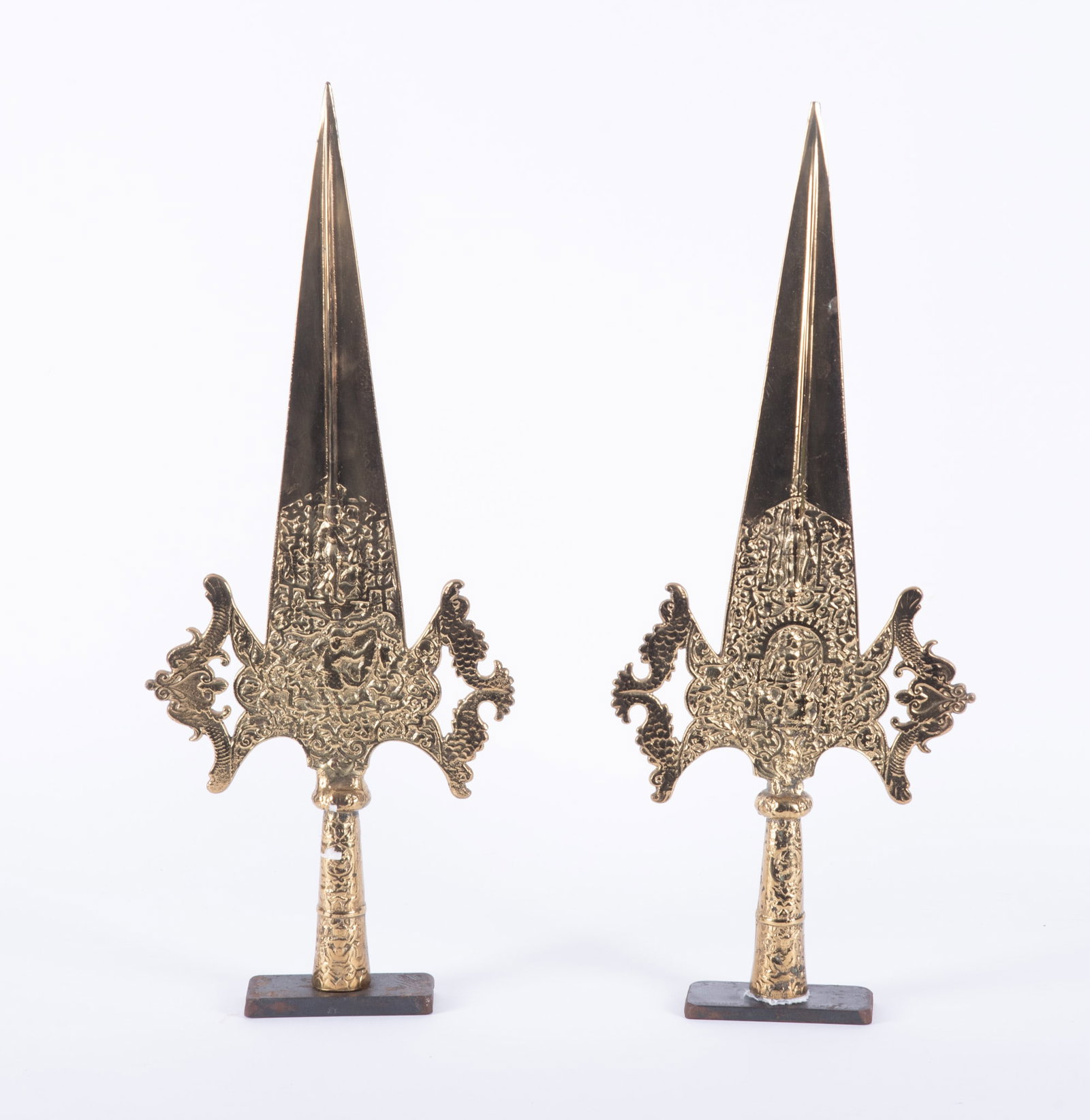 Pair of Sinhalese Ceremonial Patisthanaya Heads: Traditional Sinhalese ceremonial polearm or trident-like partisan spear originating from Sri Lanka. These ceremonial heads have been place on a weighed stands.