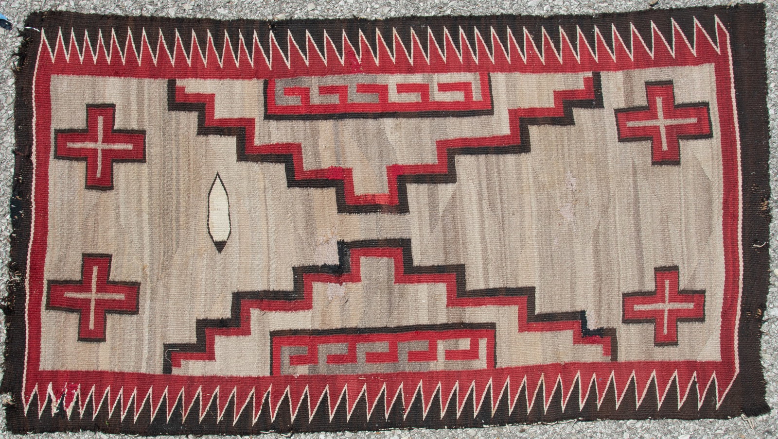 Antique Navajo Eagle Feather Rug: Probably Klagetoh with the gray background. Four crosses in the corners with stepped pattern in the middle resembles mountains. Possibly late 19th or early 20th Century.