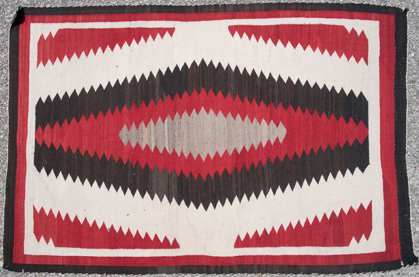 Vintage Navajo Style Wool Rug: Wool, features serrated diamond motif with a central gray diamond.