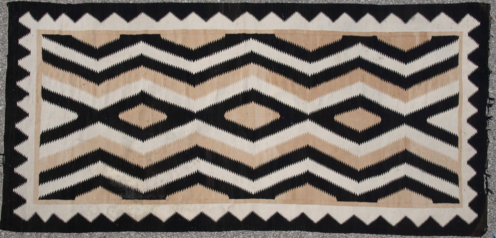 Vintage Navajo Style Non Regional Rug: Eye dazzler design of tan, white and black. Circa 1940s. Wool.