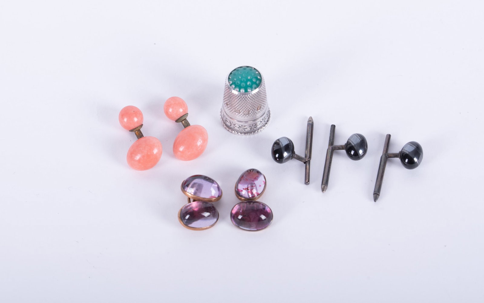 Antique Sterling Germany Floral Design Sewing Thimble together with Gentlemen's Vintage Cuff Links: thimble marked, with floral and beaded design, weight 0.155 troy ounce; gentlemen's jewelry comprising two pairs of Vintage cufflinks, one coral and one amethyst and three banded agate studs; jewelry 