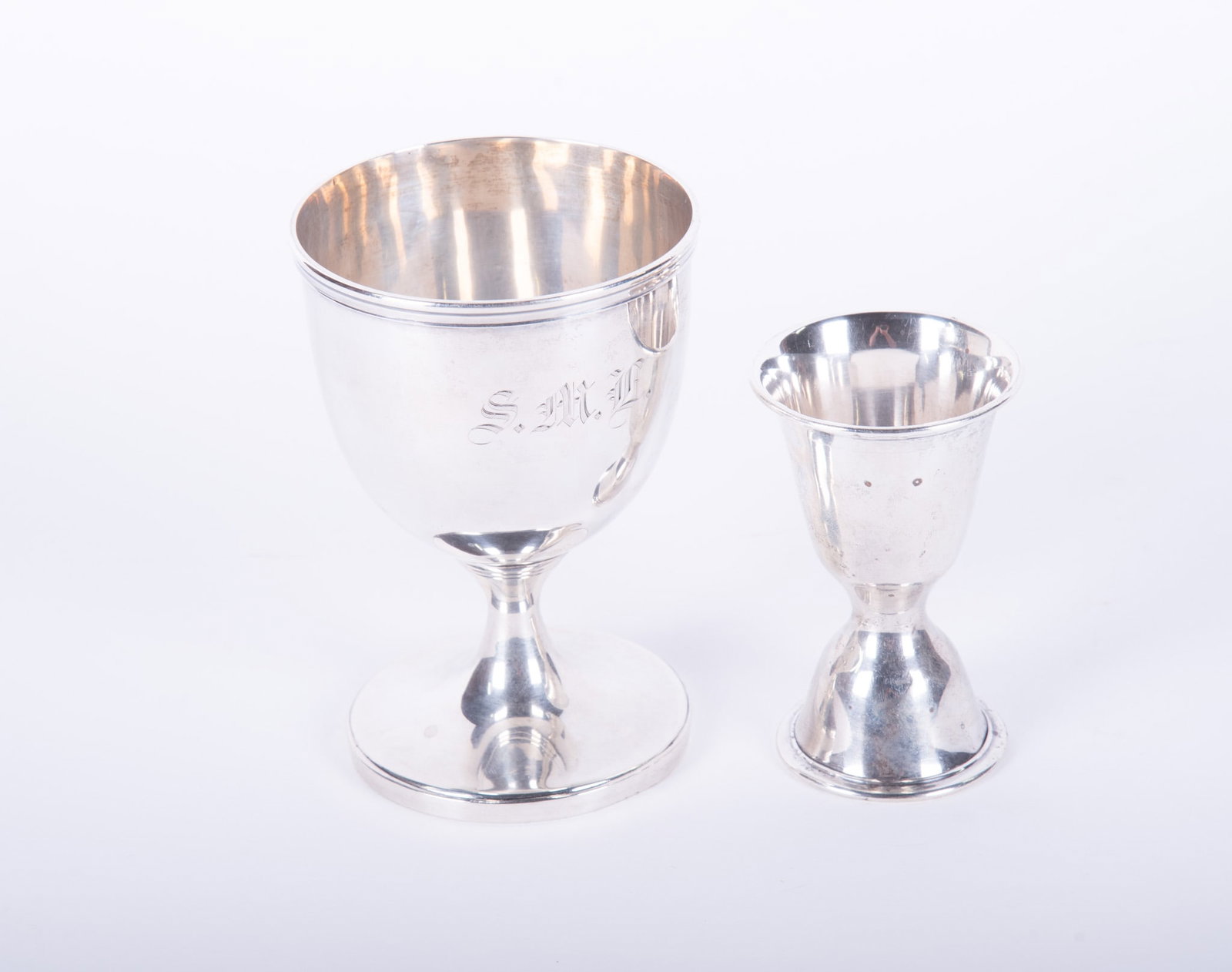 Coin Silver Chalice along with a Sterling Shot Measuring Cup (1 of 3)