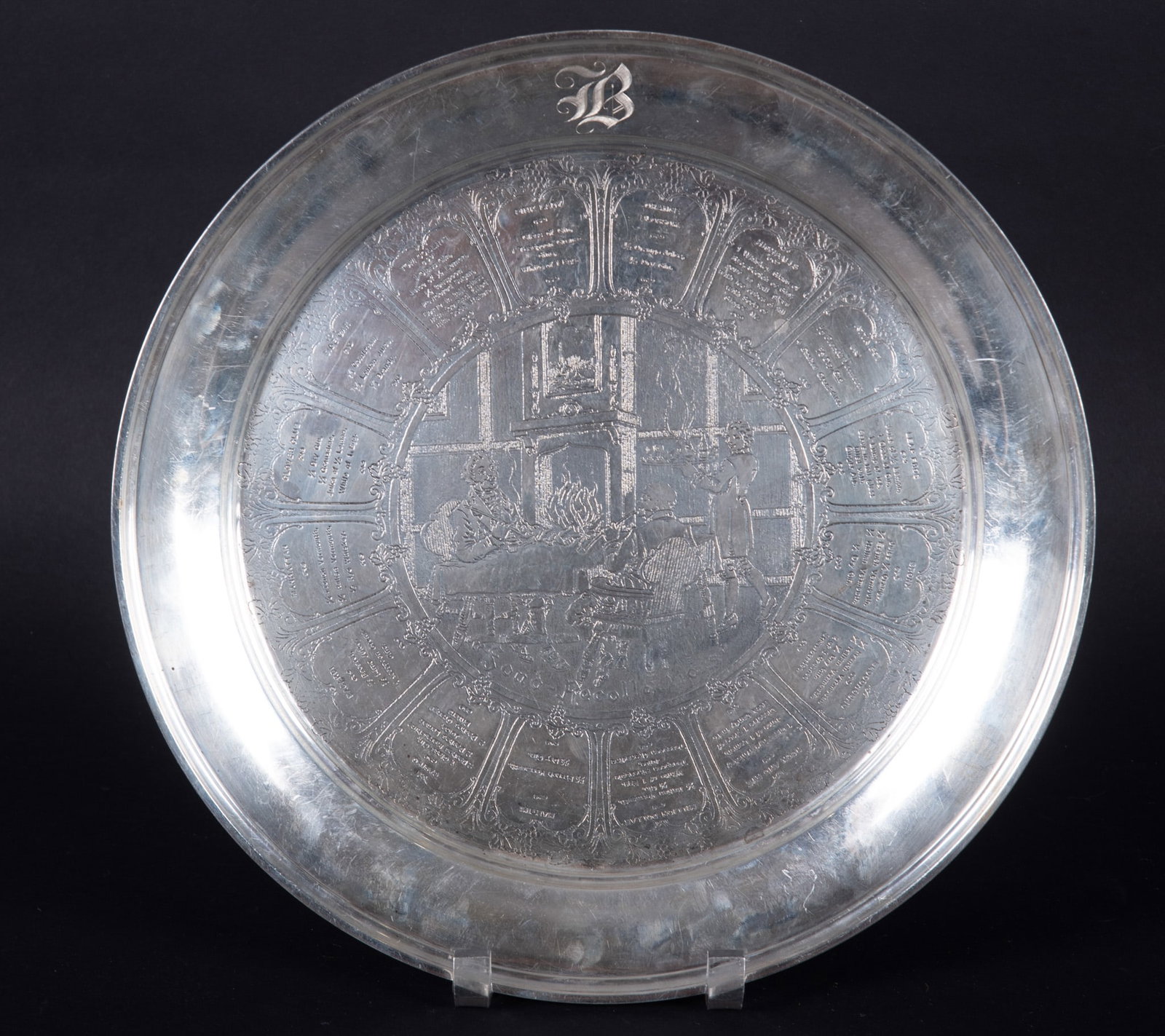 A Rare Weidlich Sterling Silver Art Deco Cocktail Tray: Bridgeport CT, a rarely found large cocktail bar tray by Weidlich sterling company of Connecticut. The pictorial middle medallion titled "Fond Recollections" featuring men smoking pipes near a firepla
