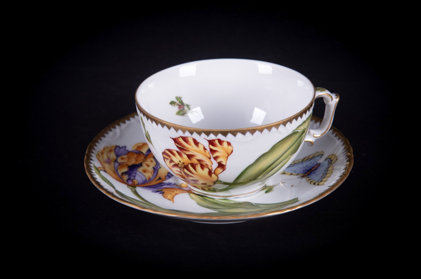 An Anna Weatherley Porcelain Cup and Saucer, Old Master Tulips: Hungary, a classic Anna Weatherley Design large cup and saucer, both pieces featuring large tulip blooms, butterflies and insects.
