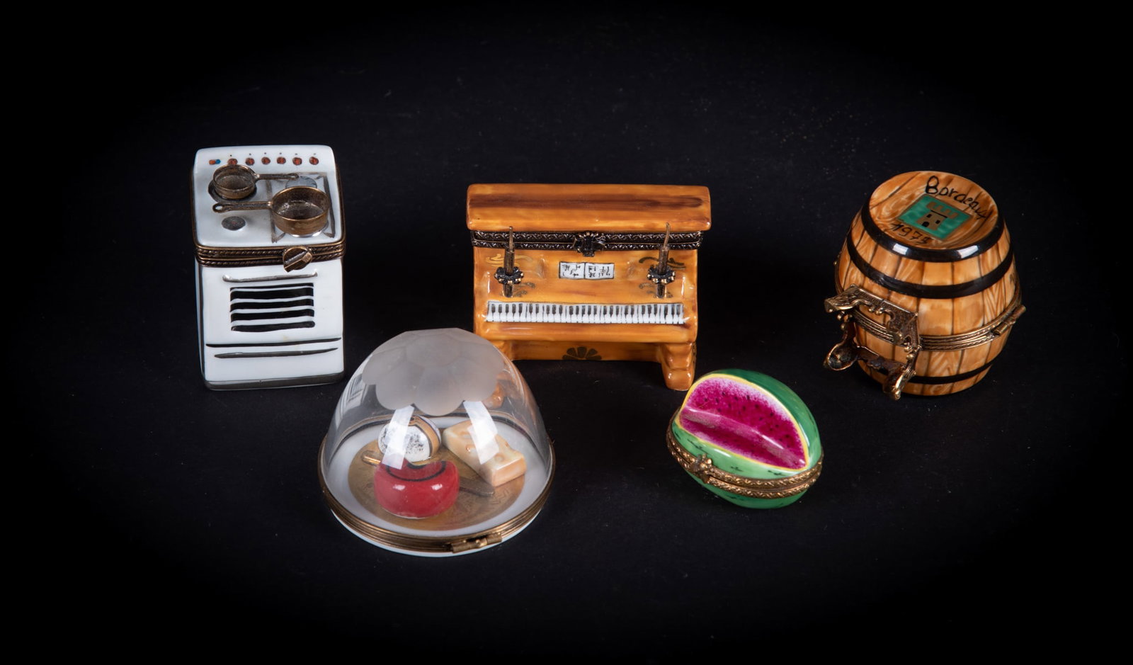 Six Limoges Porcelain Boxes: France, a porcelain Stove with Cooking Pans; an Upright Piano; a rare Wine Barrel with Bottles inside; a crystal covered Cheese Plate; a Watermelon; and a Blue Passport book.