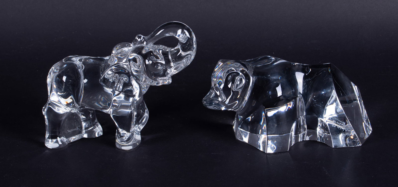 A Large Baccarat Crystal Elephant and Bear: France, late 20th century, both the elephant and bear having the Baccarat acid mark to bottom of base and script mark to side of base.