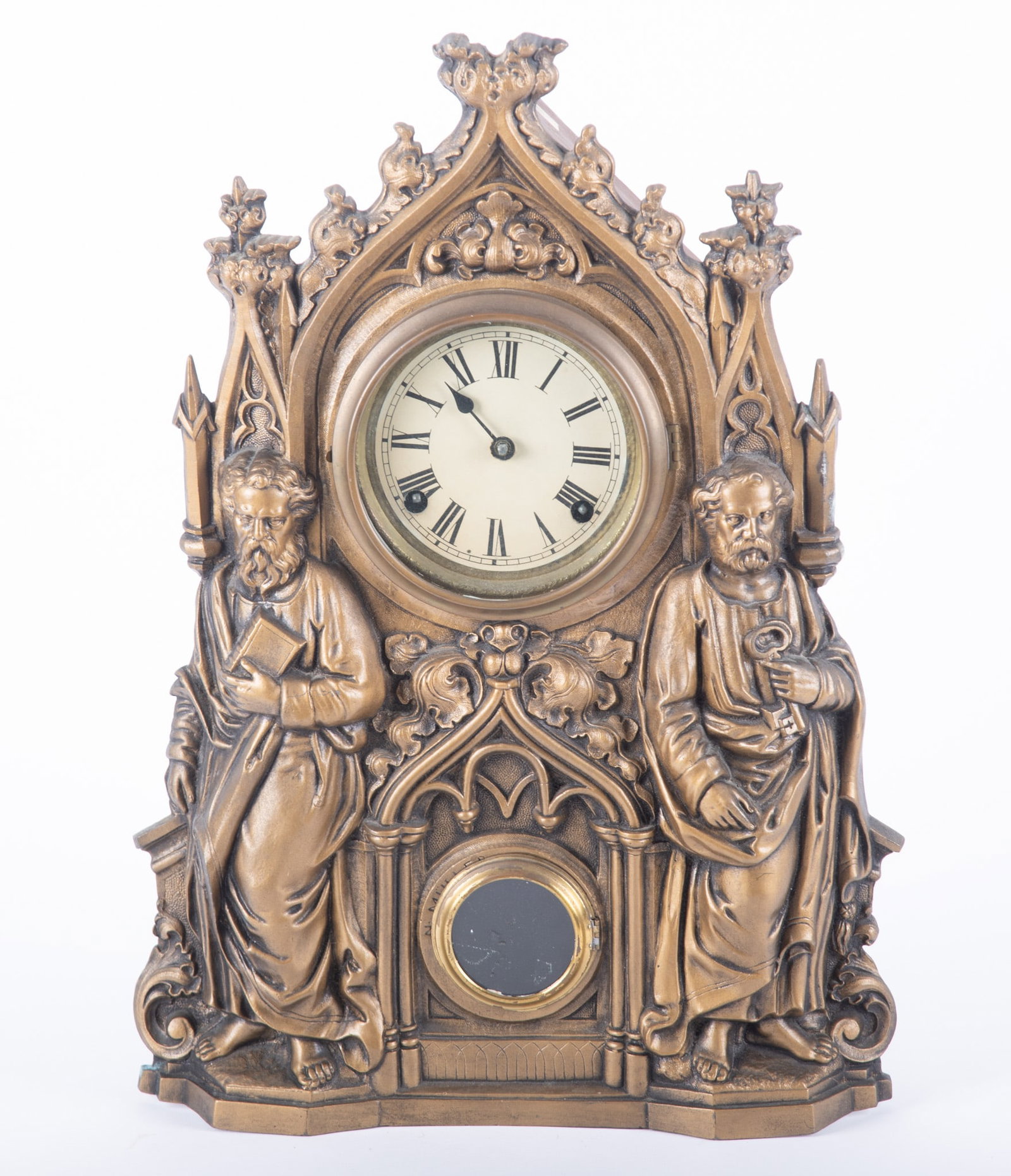 A Muller Saint Peter and Paul Iron Front Clock: A Muller Saint Peter and Paul Iron Front Clock 19the century, the iron front clock with wood case in an old bronze finish, the sculptured front having a small glass opening and paper dial. 13 1/2 x