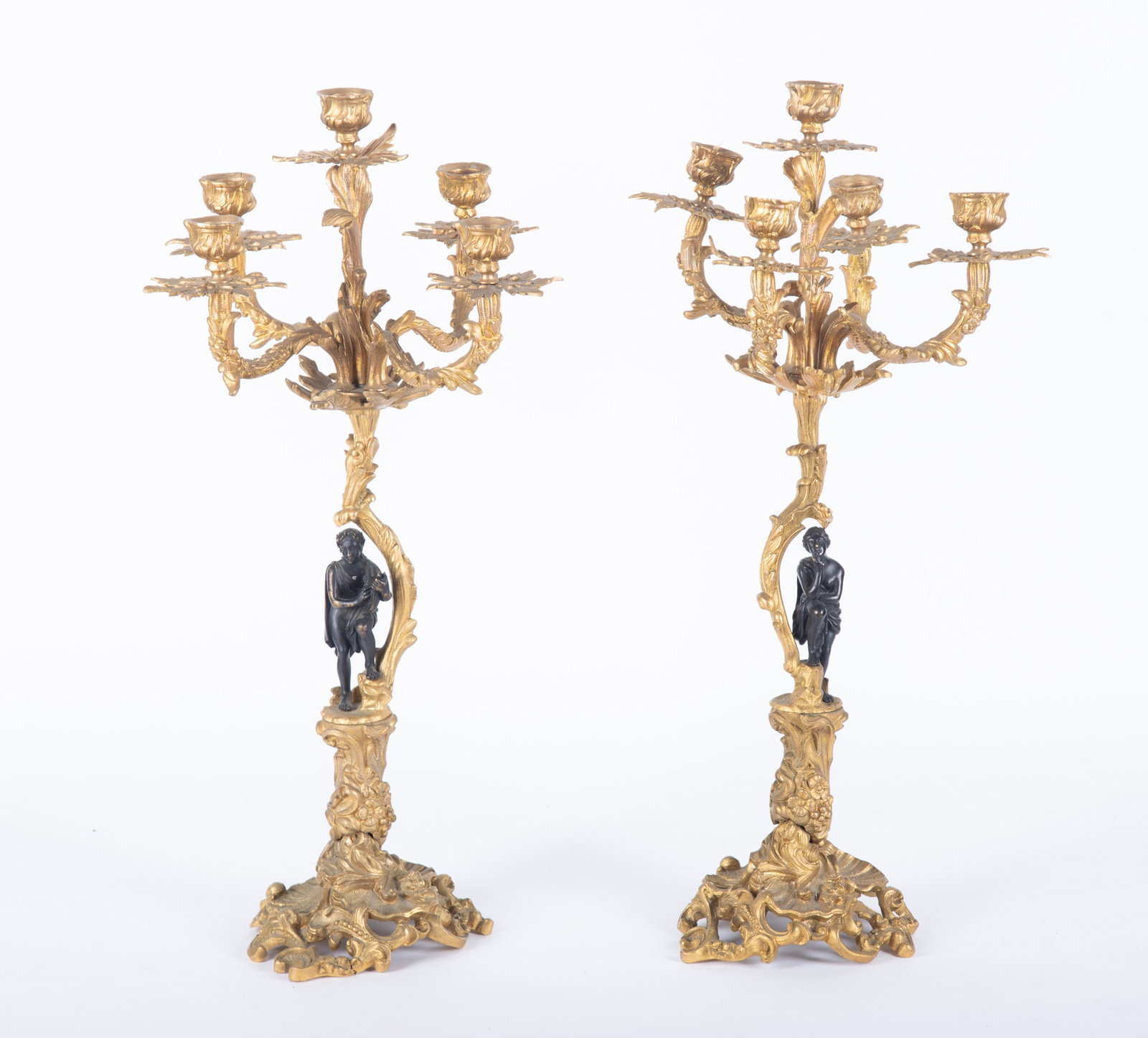 A Pair of Antique French Gilt and Patinated Bronze Five-Arm Candelabra: A Pair of Antique French Gilt and Patinated Bronze Five-Arm Candelabra France, 19th century, the pair of 5-arm candelabra having sea-shell form bases with classical figures on the stems, the arms