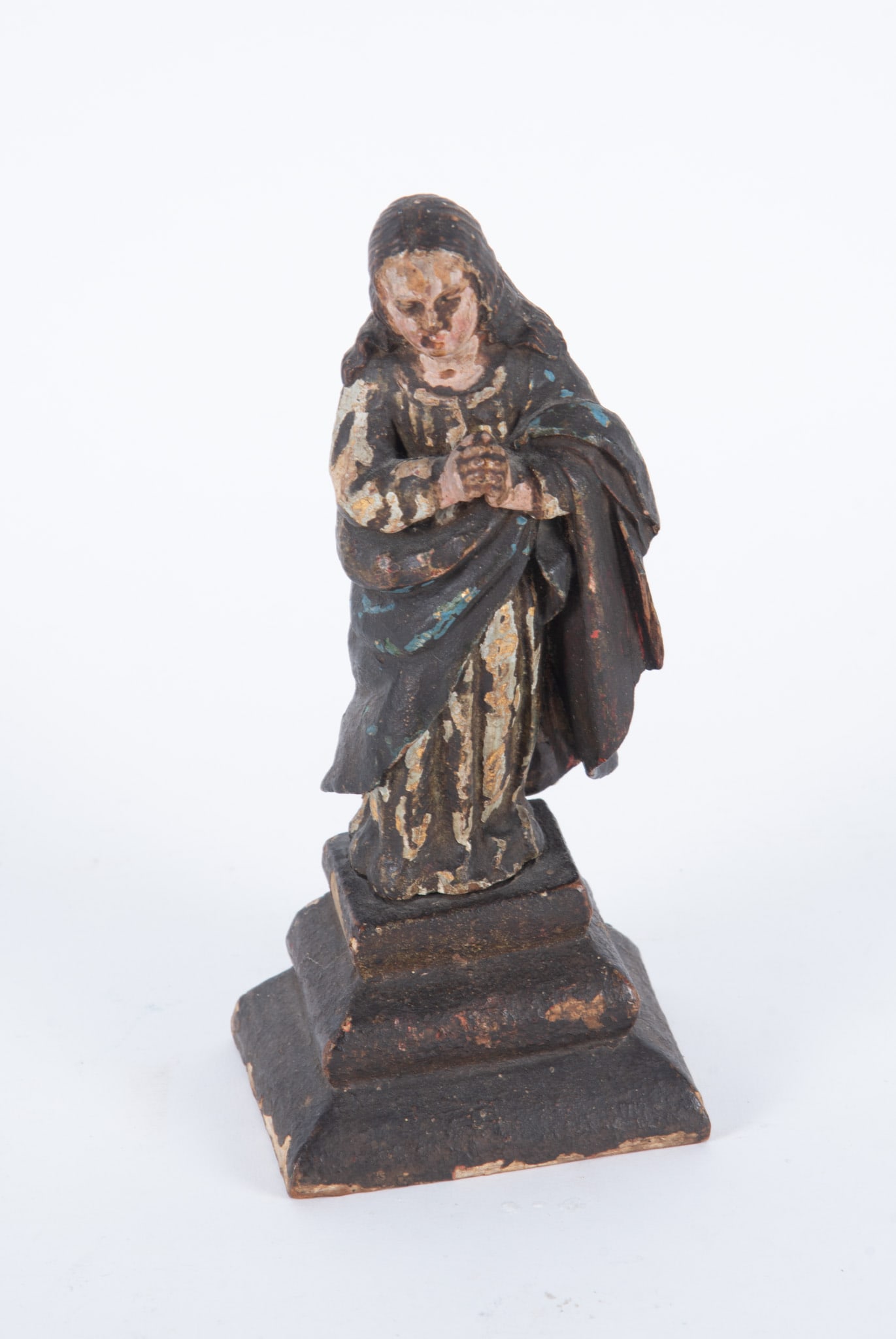 An Antique Carved Polychrome Figure of the Virgin: An Antique Carved Polychrome Figure of the Virgin Likely Spanish, the early devotional figure of the immaculate Virgin standing atop a step based. The flowing robe retaining traces of gilding and colo
