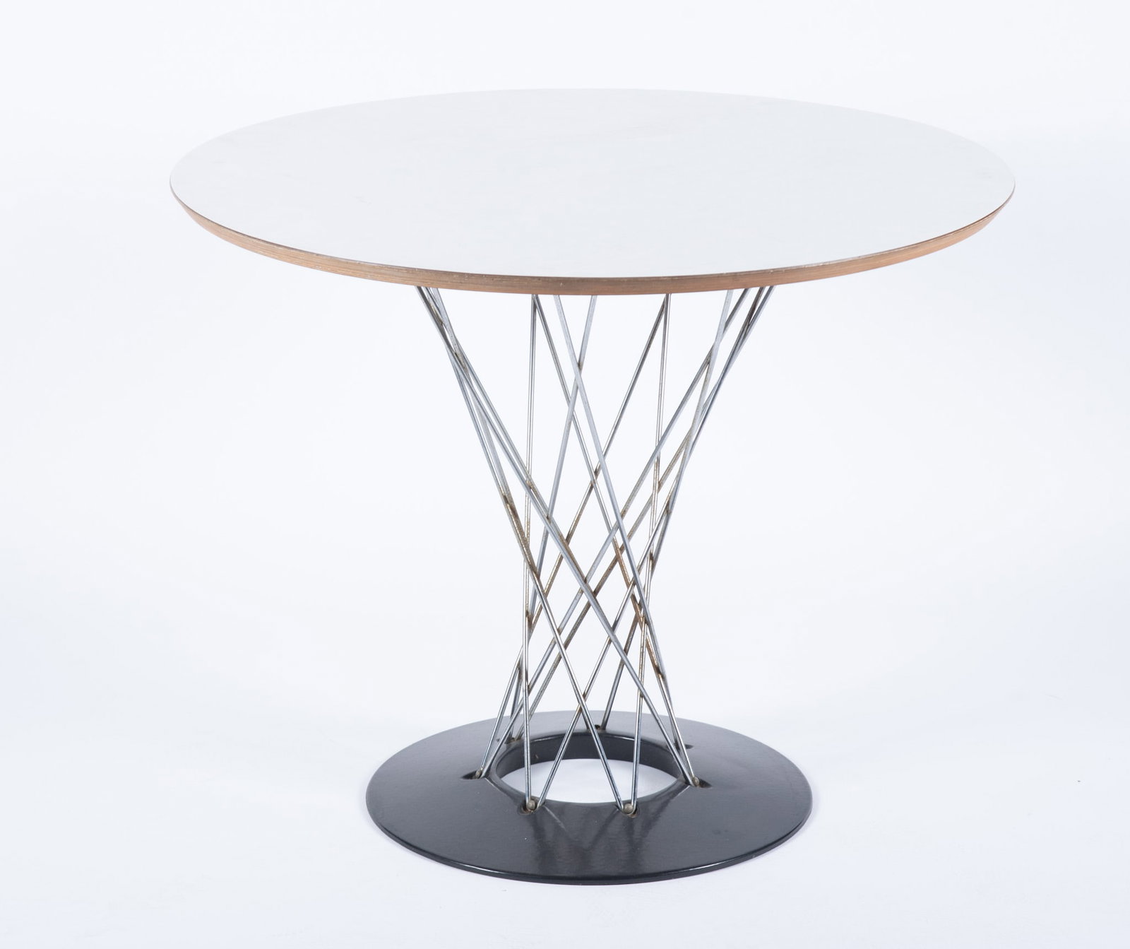 Isamu Noguchi for Knoll 'Cyclone' Table: Isamu Noguchi for Knoll 'Cyclone' Table plywood and laminate steel. The circular Formica top supported by a network of steel beams cinching near the ebonized steel base, with label. 29 x 35 1/2 inches
