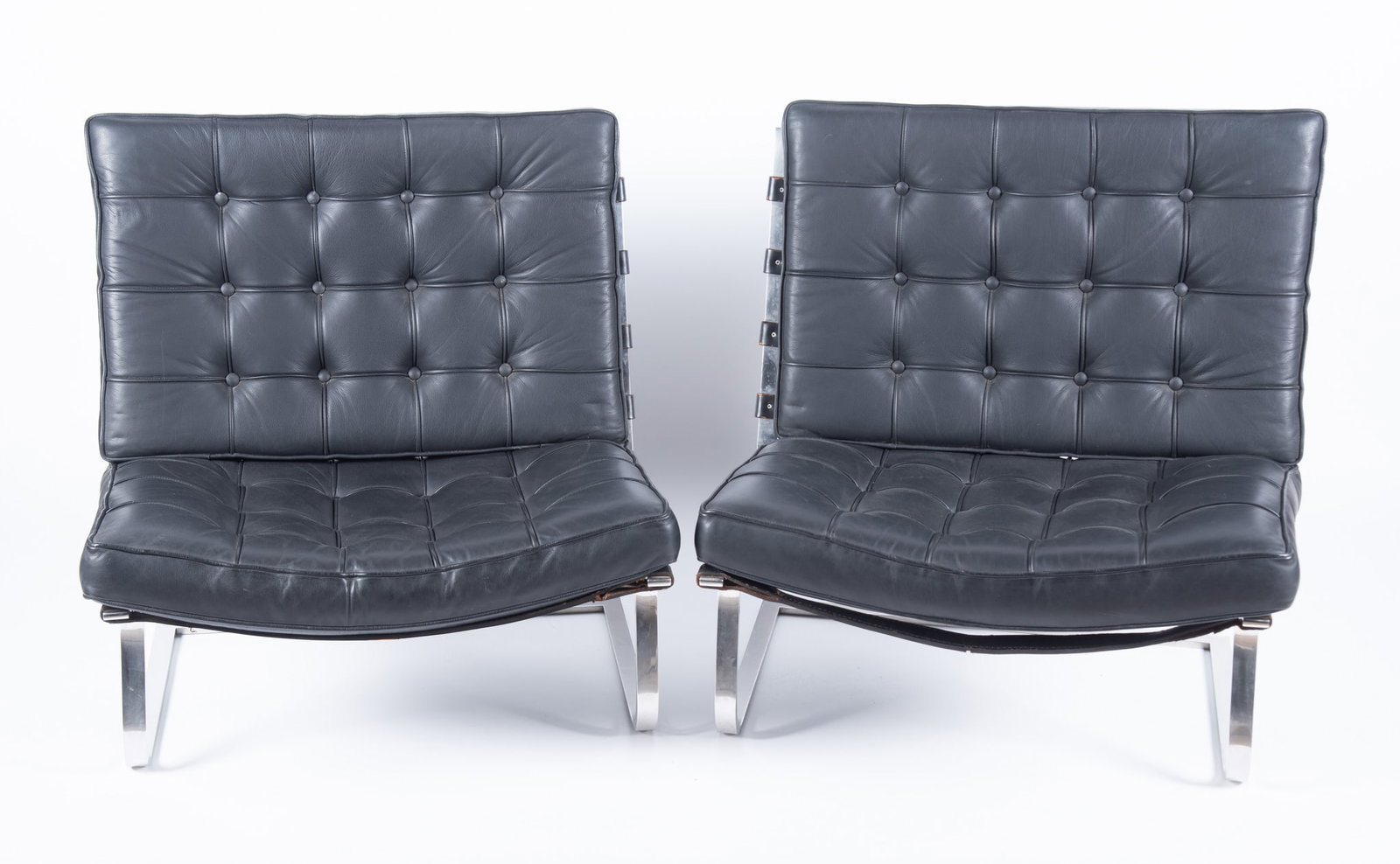 A Pair of Mies Van Der Rohe "Tugendhat" Lounge Chairs by Knoll: A Pair of Mies Van Der Rohe "Tugendhat" Lounge Chairs by Knoll Model MR70 with button-tufted backs and seats on sling-style frames, both frames branded "K" with other markings to the bottom.