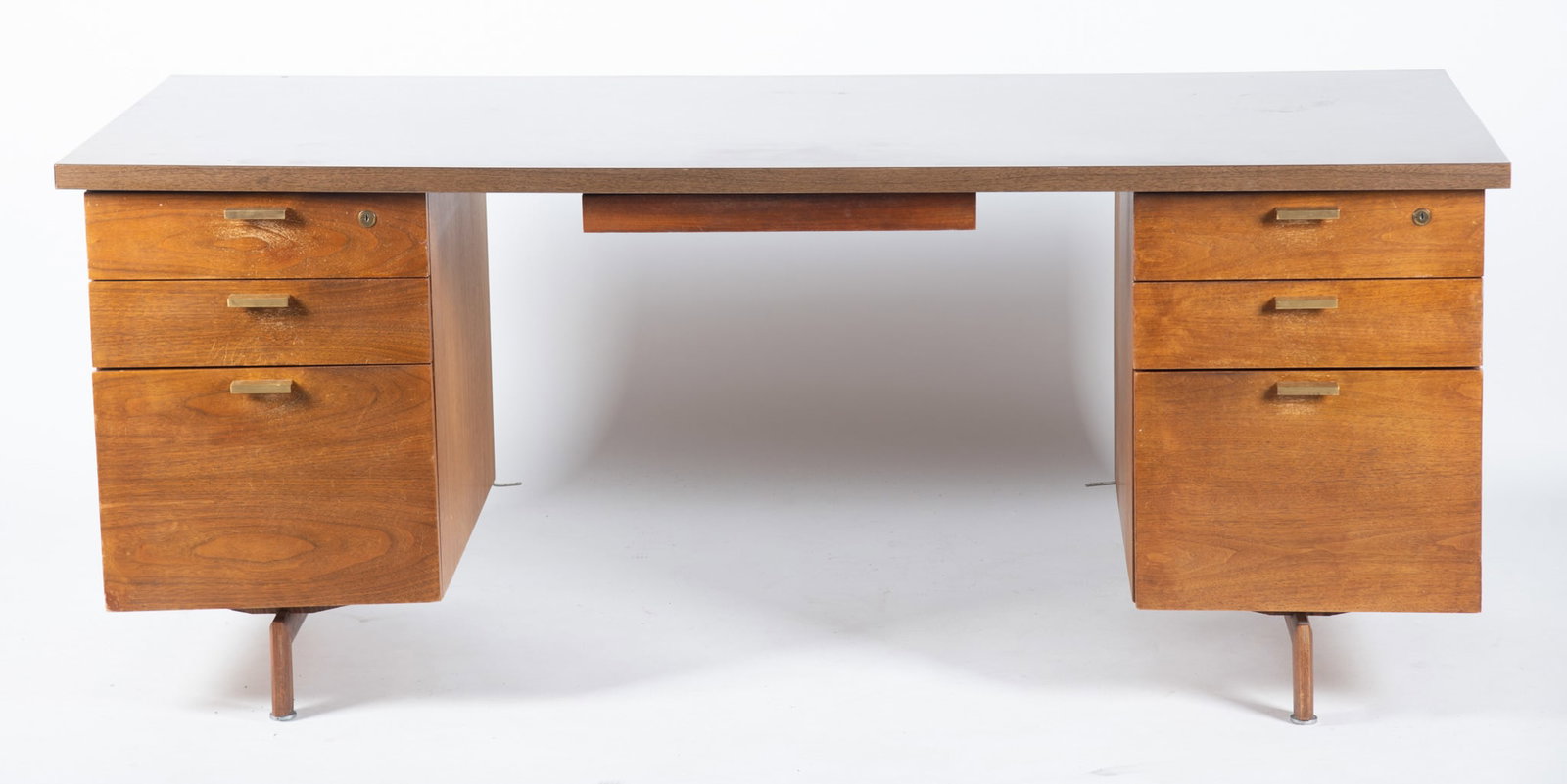 Mid Century Modern Robert John Desk: Mid Century Modern Robert John Desk Rectangular laminated top above a long center drawer flanked by four short drawers and two deeper drawers ending on flat rectangular legs. 29 x 72 x 30 inches