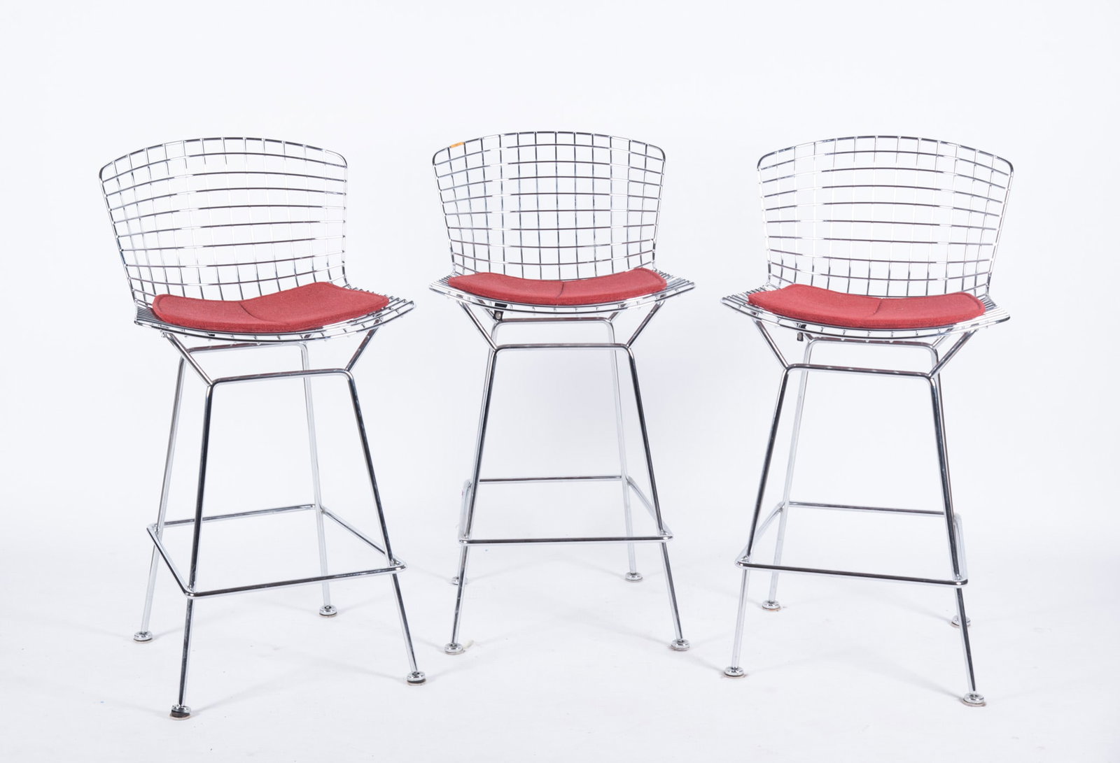 Three Vintage Harry Bertoia for Knoll Wirework Stools: Three Vintage Harry Bertoia for Knoll Wirework Stools Original red upholstered cushions. Seat Back: 38 3/4 inches; Seat Height: 28 1/2 inches