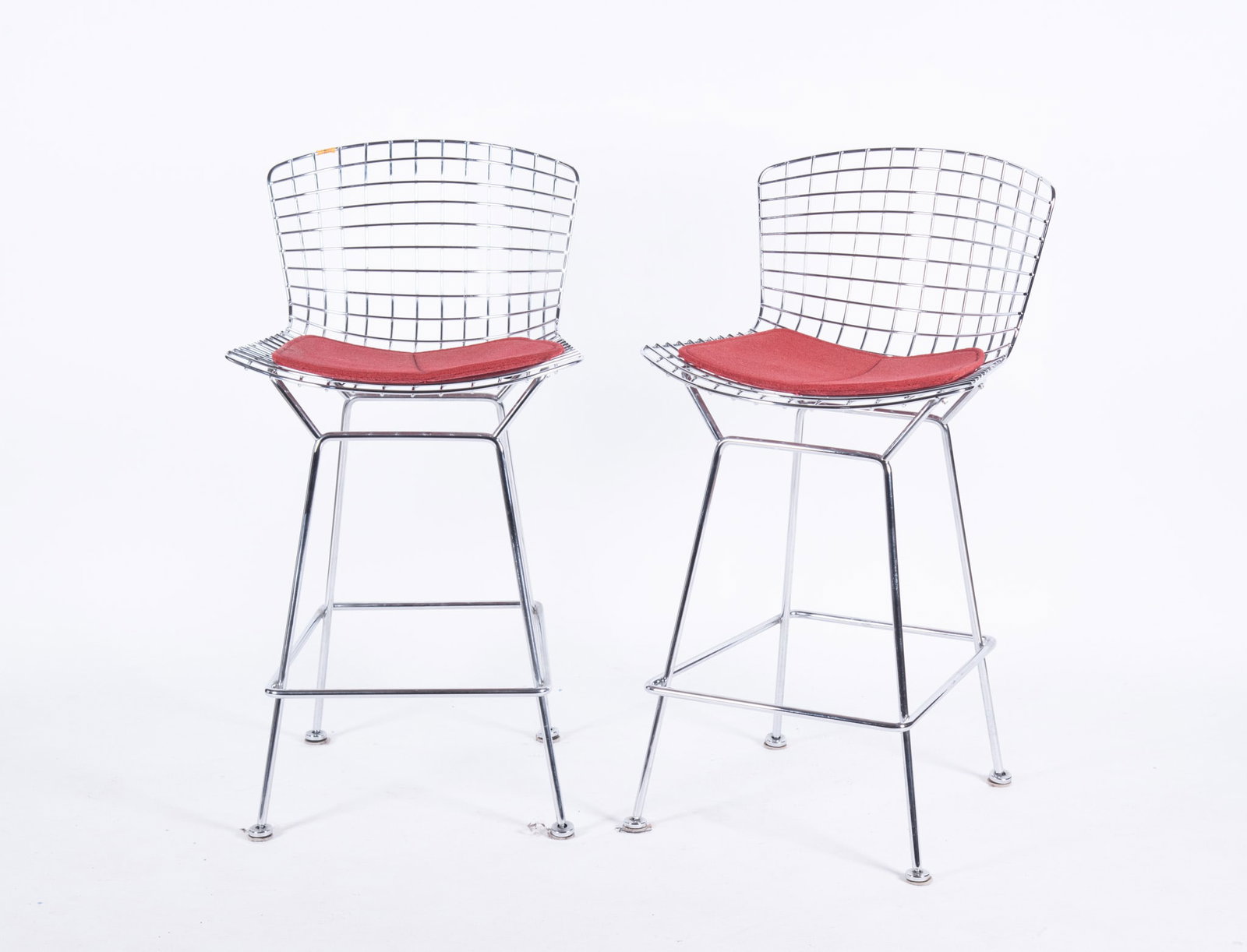 A Pair of Vintage Harry Bertoia for Knoll Wirework Stools: A Pair of Vintage Harry Bertoia for Knoll Wirework Stools Original red upholstered cushions Seat Back: 38 3/4 inches; Seat Height: 28 1/2 inches