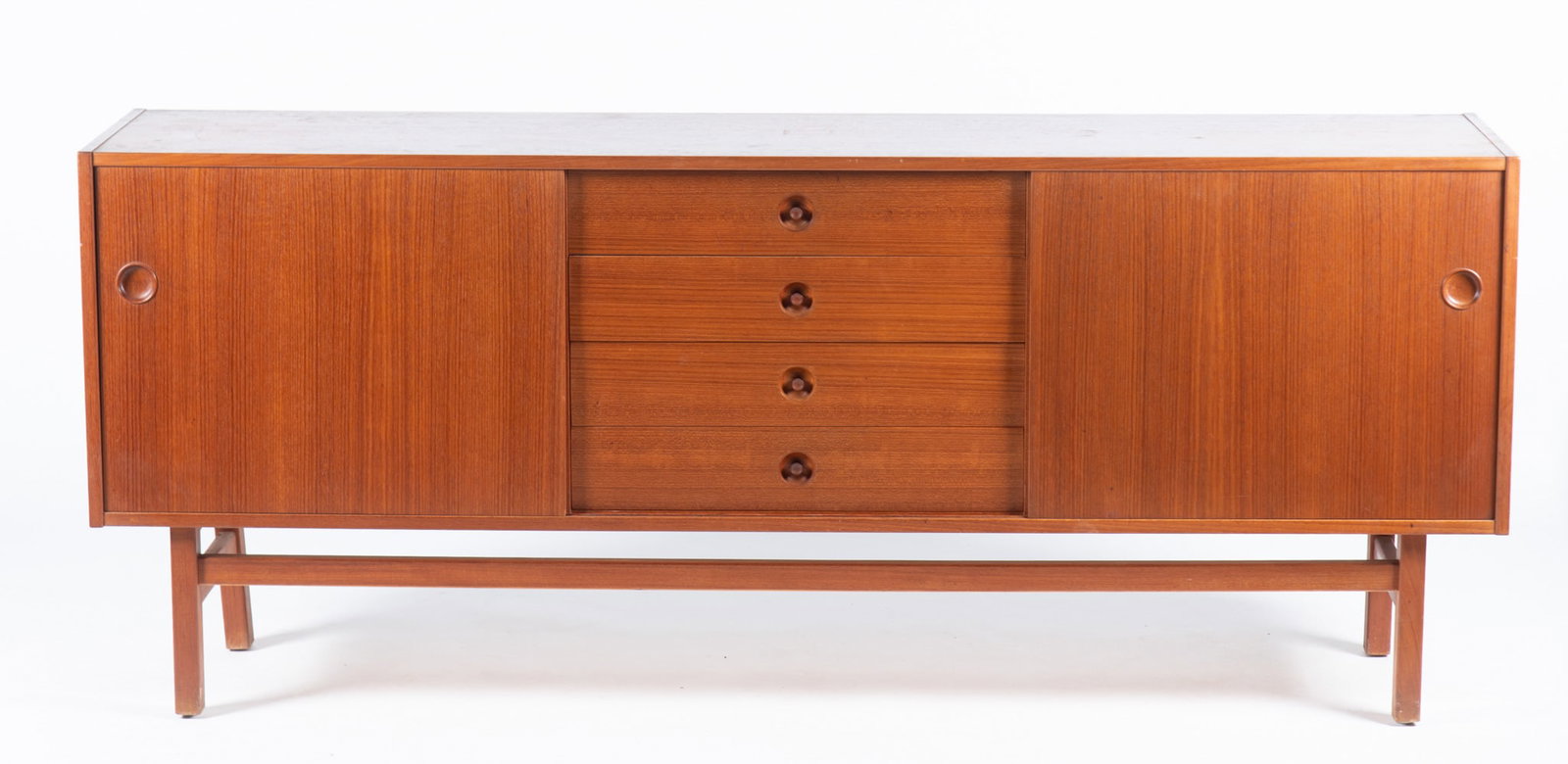Nils Jonsson Arild Sideboard: Nils Jonsson Arild Sideboard Troeds, Sweden, Circa 1960s. Teak sideboard with two sliding doors and four center drawers. Stamped inside left sliding drawer on the interior. 31 x 17 x 74 1/2 inches