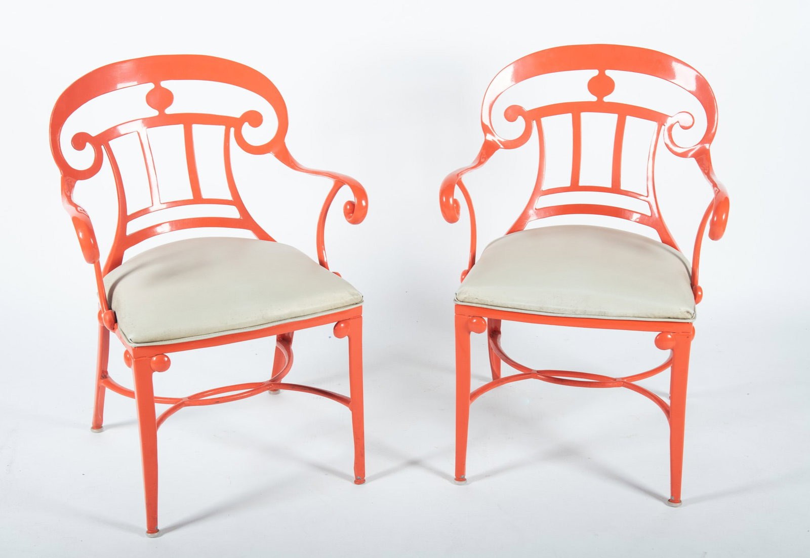 A Pair of Venemen Hollywood Regency Style Cast Aluminum Armchairs: A Pair of Venemen Hollywood Regency Style Cast Aluminum Armchairs Indoor/outdoor in tangerine orange, two armchairs. 31 1/2 x 23 x 24 inches