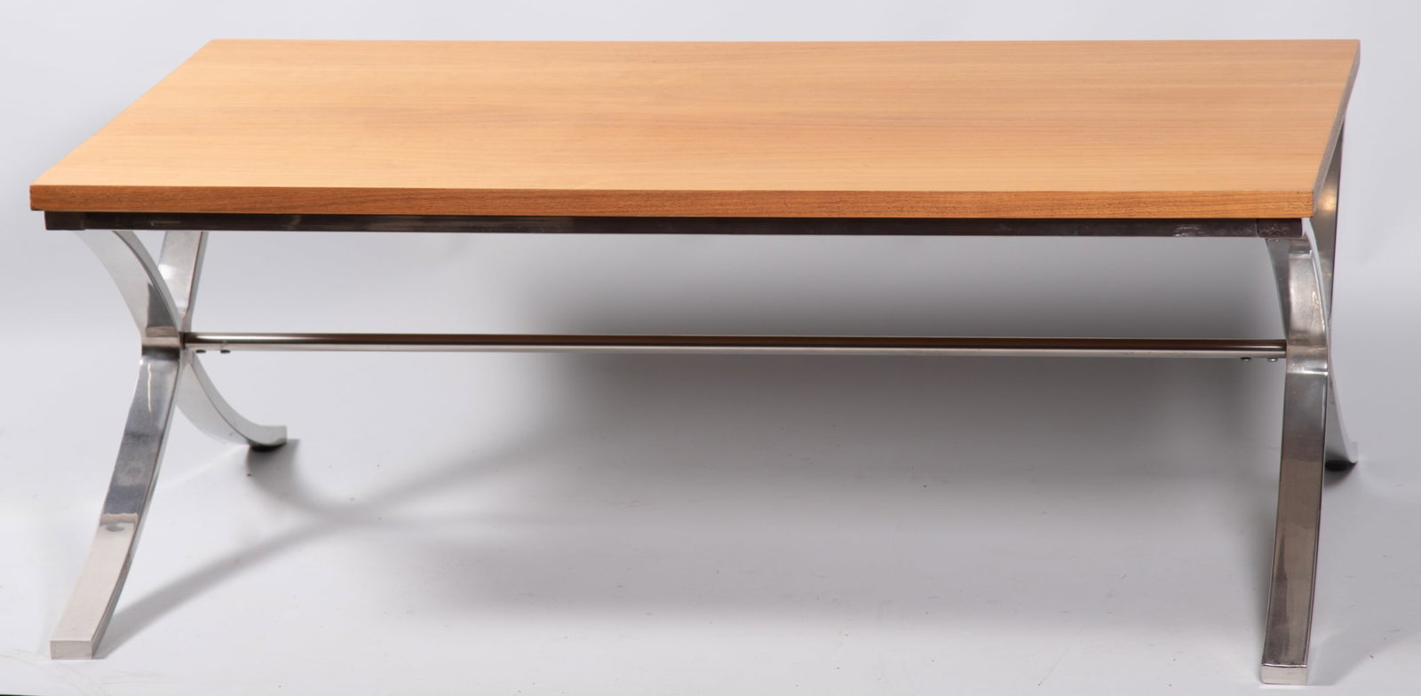 Mid-Century Modern Style Oak and Chrome Coffee Table: Mid-Century Modern Style Oak and Chrome Coffee Table Rectangular coffee table with oak top over a polished chrome metal base, the splayed supports joined by a central stretcher, creating a sleek