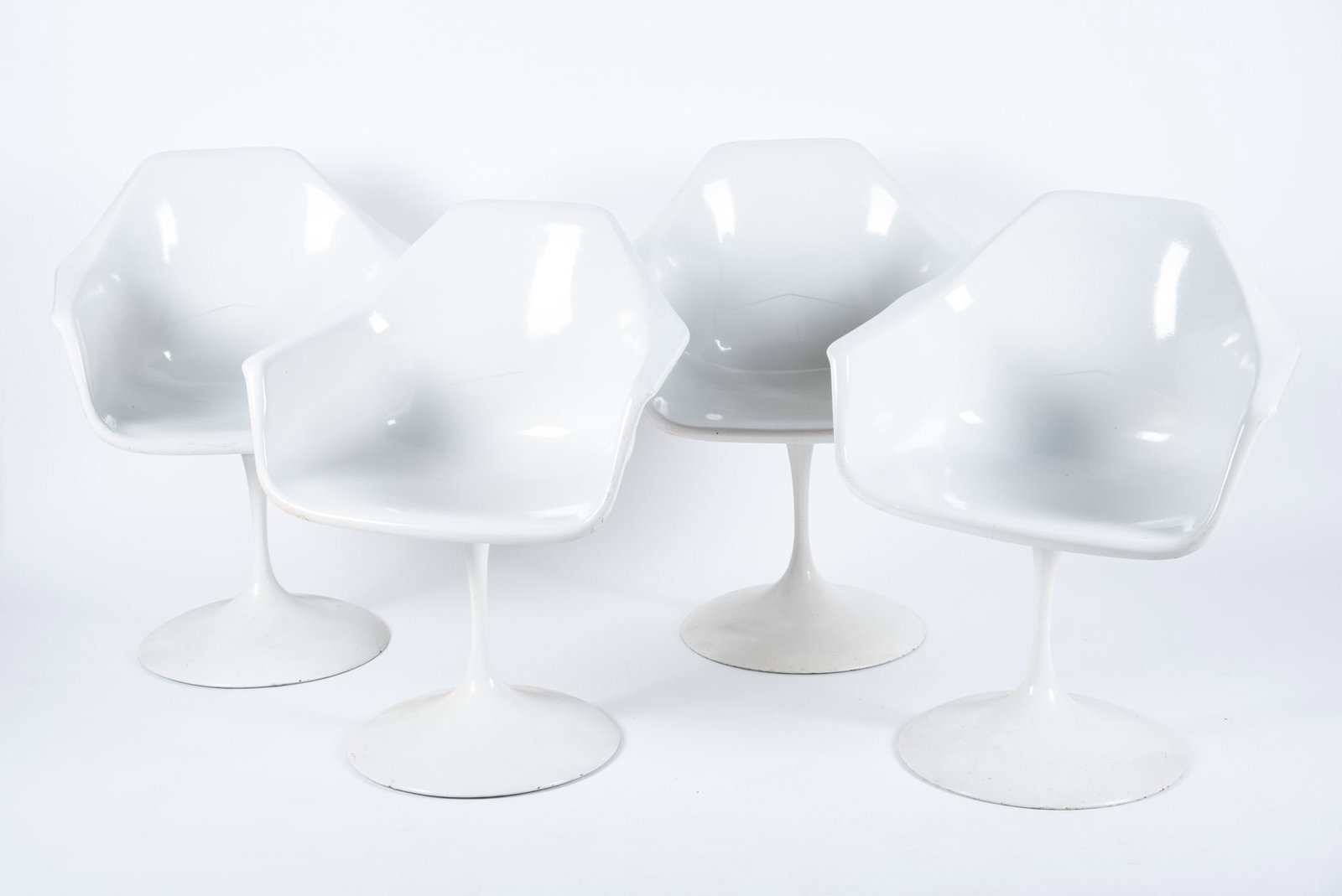Four Fiberform Inc. "Tulip" Chairs after Eero Saarinen: Four Fiberform Inc. "Tulip" Chairs after Eero Saarinen Set of four pedestal armchairs, Fiberform tags at the base. 31 x 23 x 17 inches