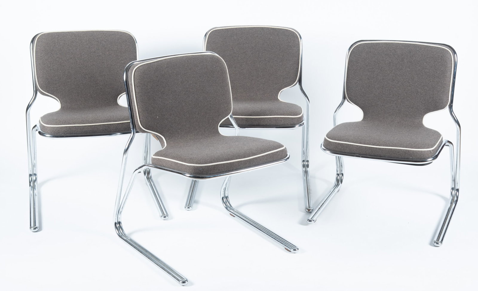 Set of Four MCM Style Cantilever Dining Chairs: Set of Four MCM Style Cantilever Dining Chairs Tubular bases with piped grey flannel upholstered cushions 30 1/2 x 26 x 23 1/2 inches