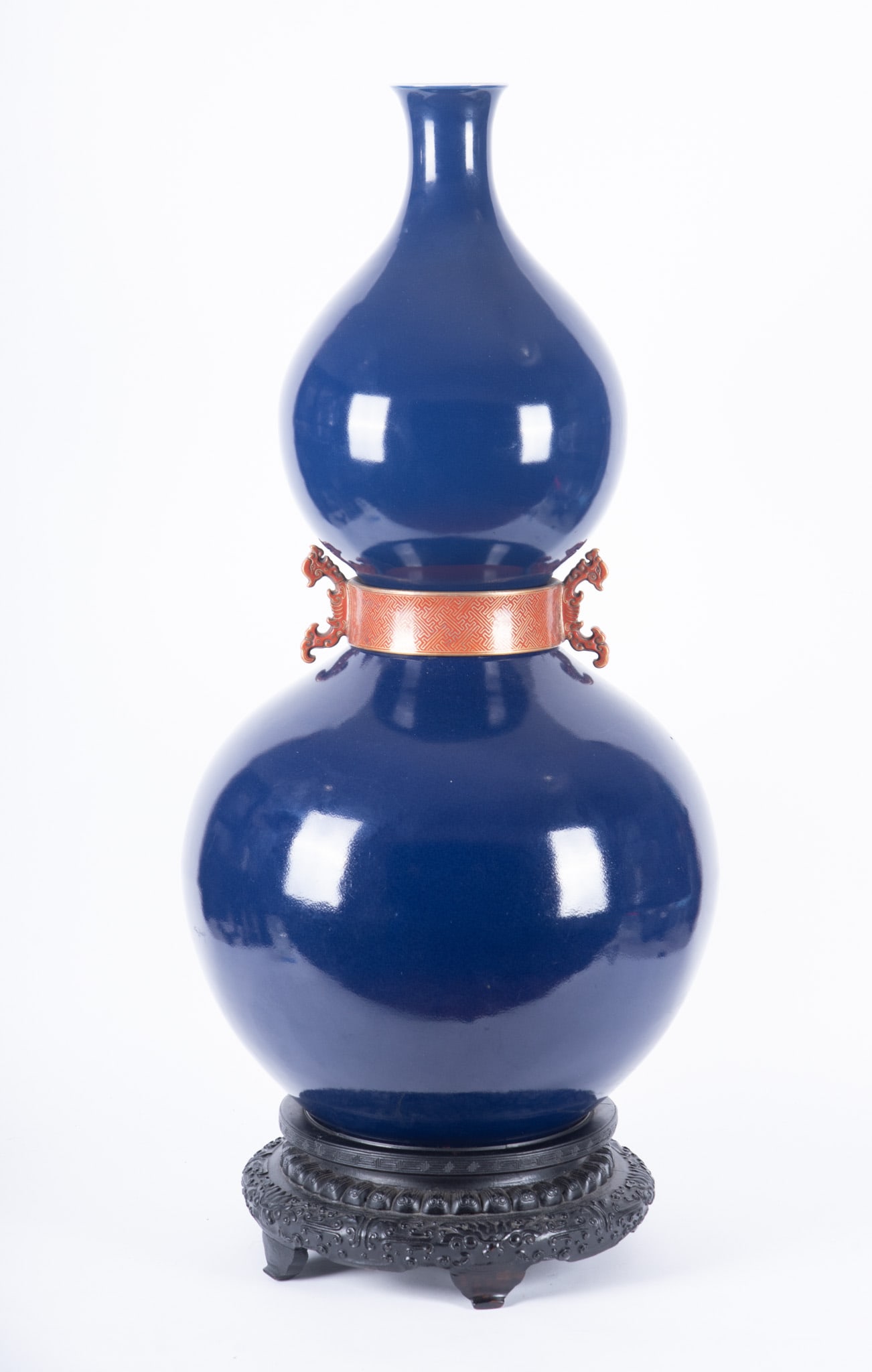 Large Blue Monochrome Double Gourd Vase: Large Blue Monochrome Double Gourd Vase Waist band. Drilled through characters on the base. In the style of Qianlong. On a stand. 37 x 17 x 17 inches