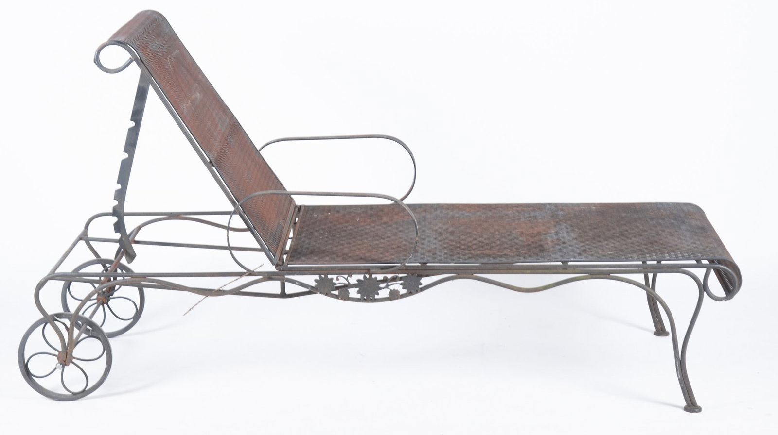 Two Wrought Iron Patio Chaise Lounge Chairs: Two Wrought Iron Patio Chaise Lounge Chairs Woodard Briarwood design chairs with adjustable backs. Both have ornate floral emblem. One with diamond mesh the other with wrought iron bands. 74 inches lo