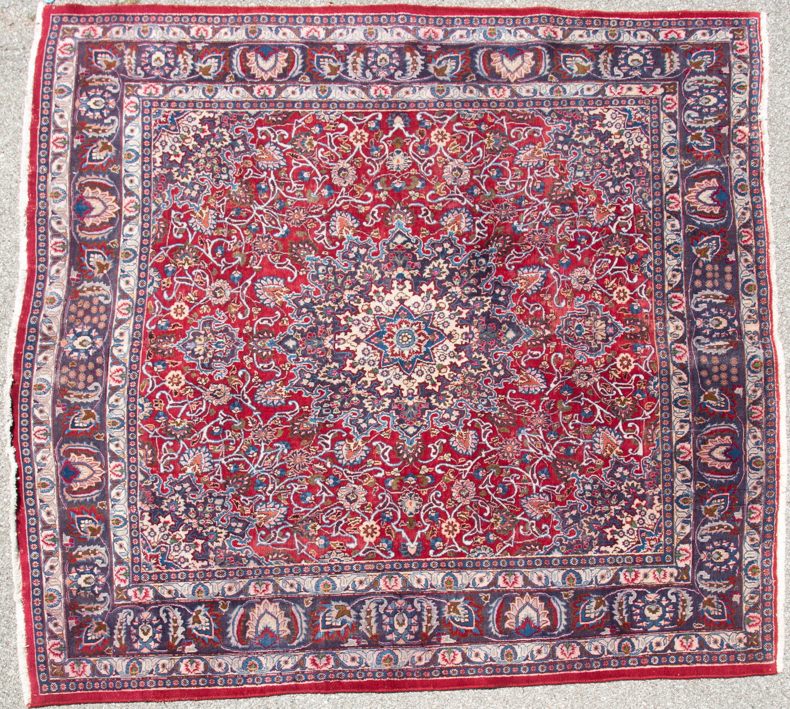 Handwoven Persian Mashad Room Rug: Handwoven Persian Mashad Room Rug Central shaped medallion in blue, red and green on a red field with blue spandrels and a wide floral filled primary border and a pair of guard borders. 9' 6" x 9' 6"
