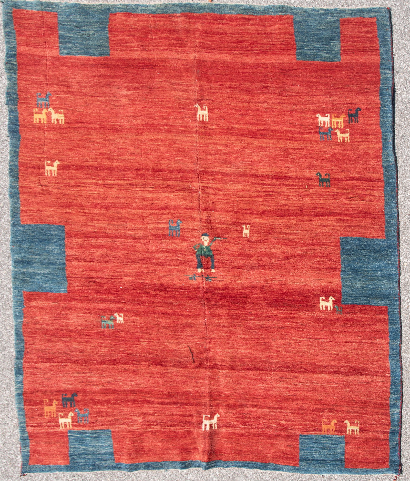 Handwoven Persian Gabbeh Room Rug: Handwoven Persian Gabbeh Room Rug Open red field with stylized figures within a blue block border. 6' 7" x 8' 5"