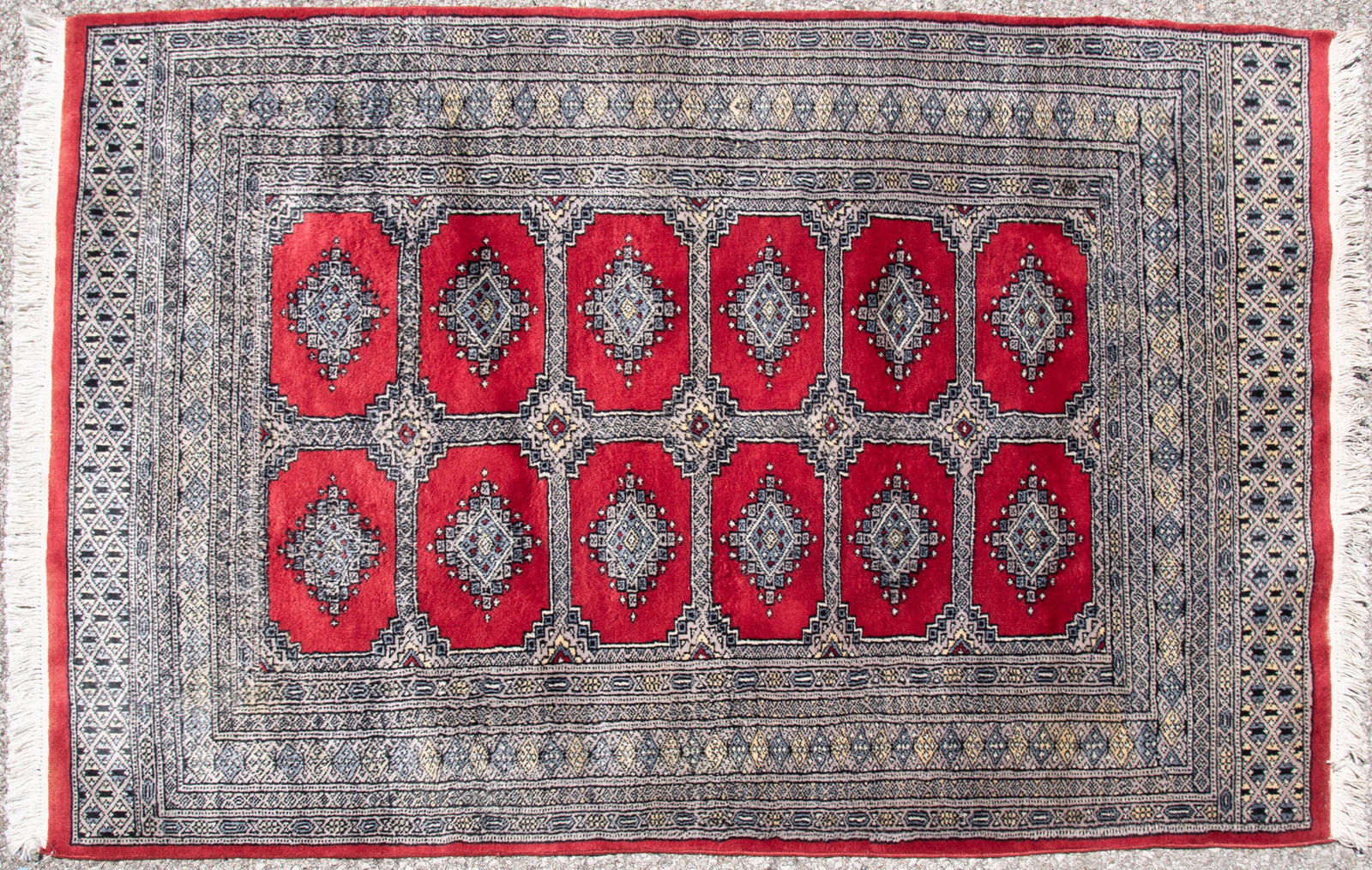 Handwoven Persian Bokhara Area Rug: Handwoven Persian Bokhara Area Rug Twelve matching elephant foot geometric motifs centering a multitude of geometric borders. 4' x 6'