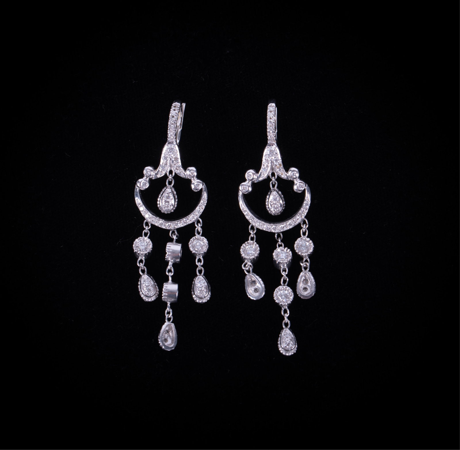 14K White Gold Diamond Earrings: 14K White Gold Diamond Earrings These glorious earrings have 1CTW in diamonds. They are 2 inches long and weigh 9g.