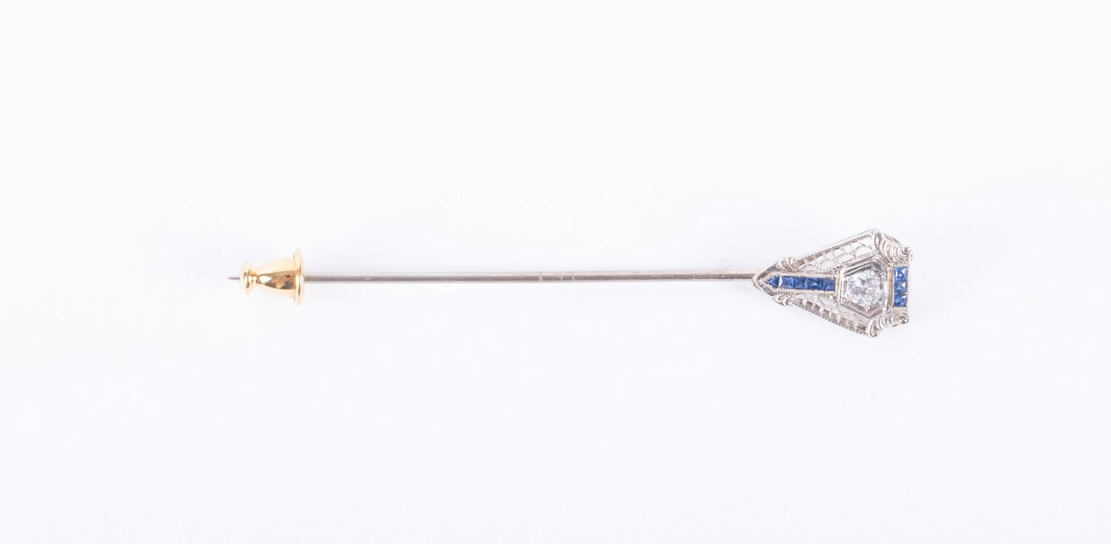 Antique 14K White Gold-Diamond & Sapphire Stick Pin: Antique 14K White Gold-Diamond & Sapphire Stick Pin This beautiful filigree stick pin has a .10 point diamond with a line of sapphires above and below. Weight including stones is 1.7g.