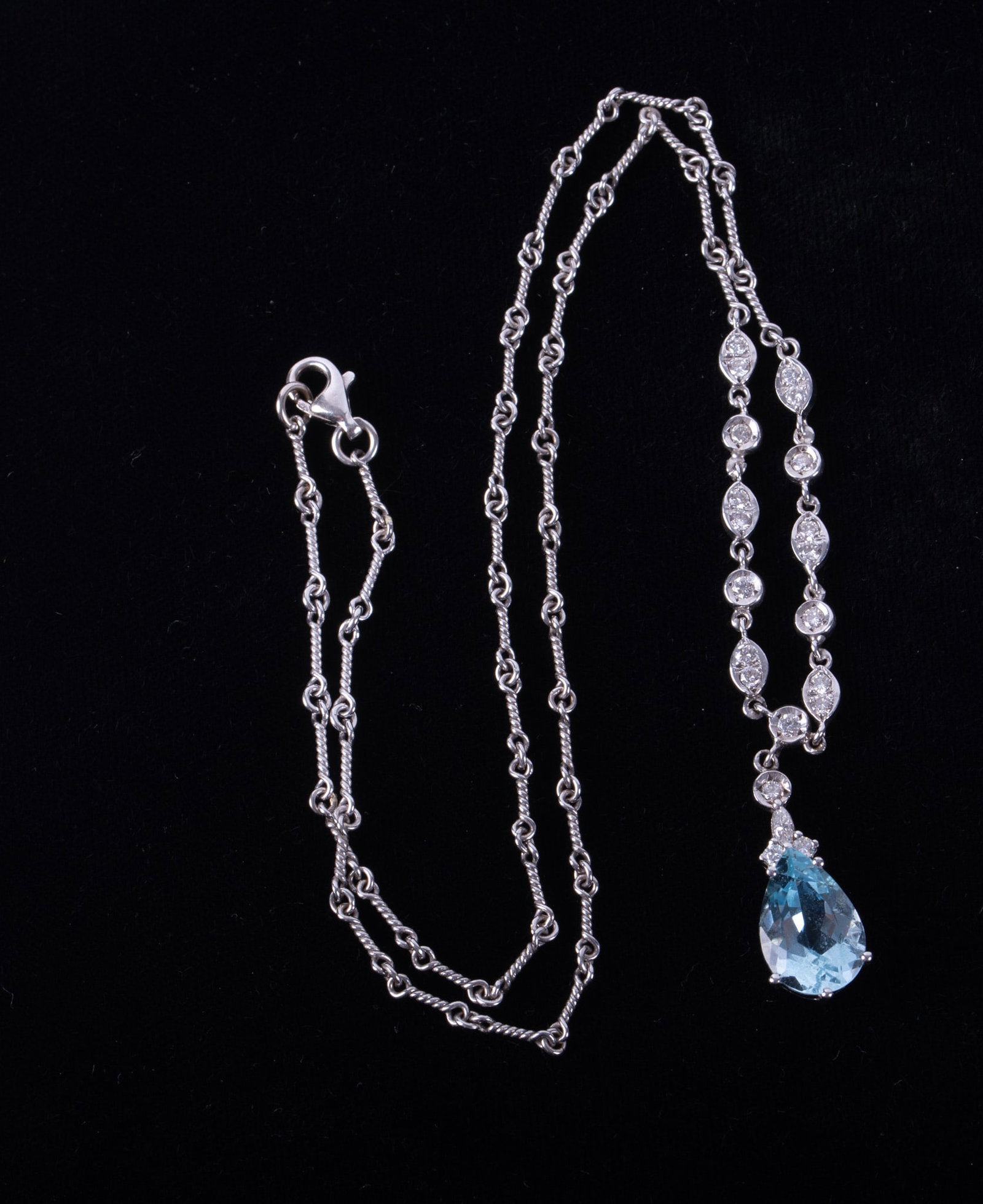 14K White Gold Necklace with Aquamarine & Diamonds: 14K White Gold Necklace with Aquamarine & Diamonds This stunning necklace has 21 diamonds weighing approximately .35CTW. The aquamarine measures 13.50mm x 9mm [at the widest point]. Necklace length 18