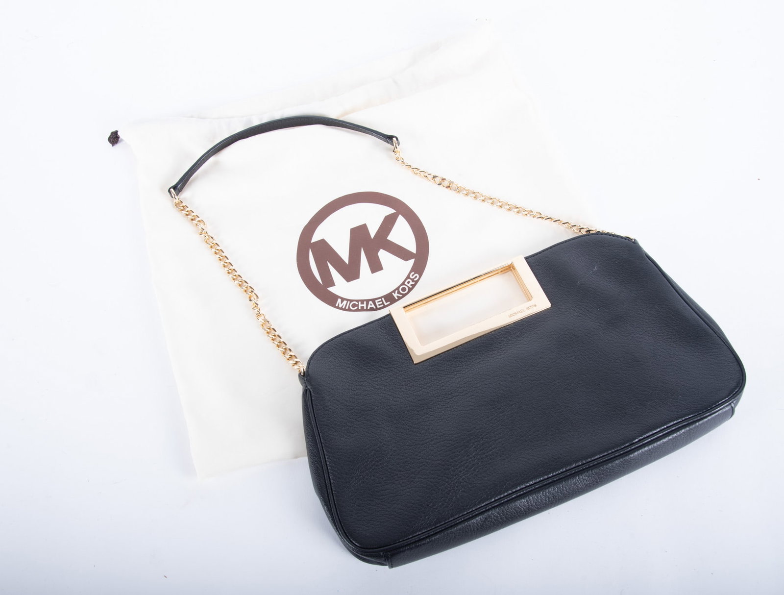 Unique Michael Kors Brown Calfskin Large Clutch Style Handbag: Unique Michael Kors Brown Calfskin Large Clutch Style Handbag This unique large clutch style bag with gold hardware and a gold chain and leather shoulder strap; like new condition with Michael Kors du