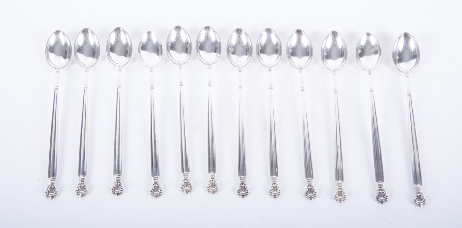 Twelve Sterling Silver Ice Tea Spoons, Acorn by Georg Jensen: Twelve Sterling Silver Ice Tea Spoons, Acorn by Georg Jensen Denmark, late 20th century, from the pattern first introduced in 1915, twelve sterling ice tea spoons in the Acorn or Konge pattern by Geor