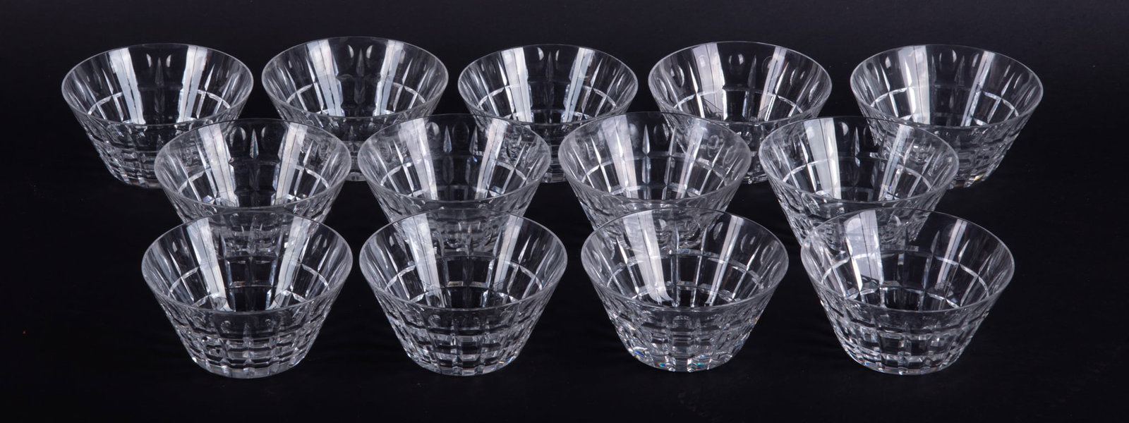 Thirteen Hawkes Cut Crystal Bowls: Thirteen Hawkes Cut Crystal Bowls Of conical form, the finger-bowl size pieces deep cut and polished. 13 bowls 2 1/8 x 4 1/2 inches