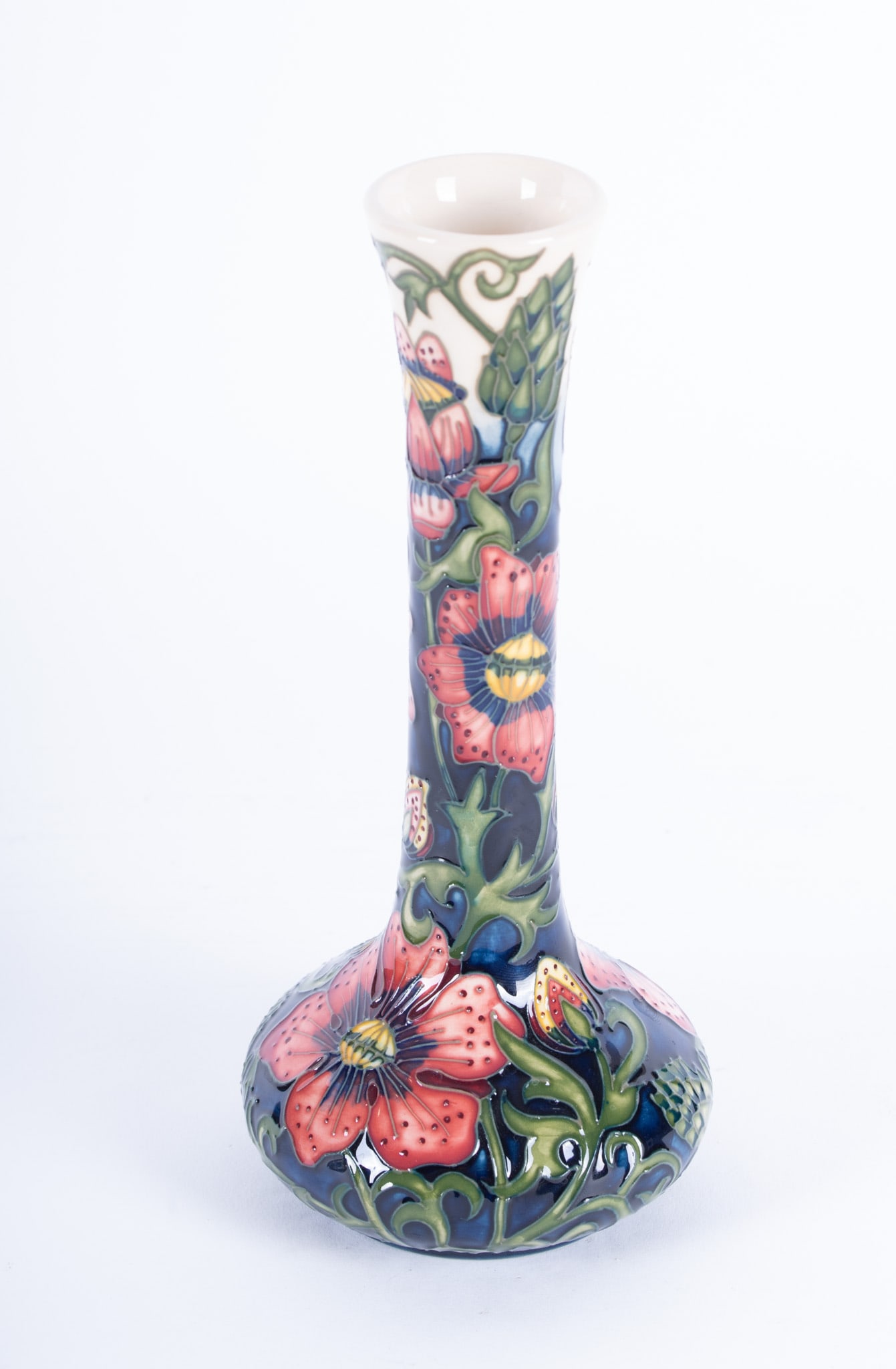 An English Pheasant's Eye Pottery Vase, Shirley Hayes for Moorcroft: An English Pheasant's Eye Pottery Vase, Shirley Hayes for Moorcroft England, circa 2000, a finely crafted and colorful Moorcroft vase designed by Shirley Hayes with large floral blooms on a blue groun